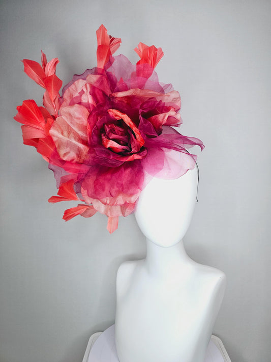 kentucky derby fascinator black headband with very large burgundy wine coral red organza flower and coral red branching feathers