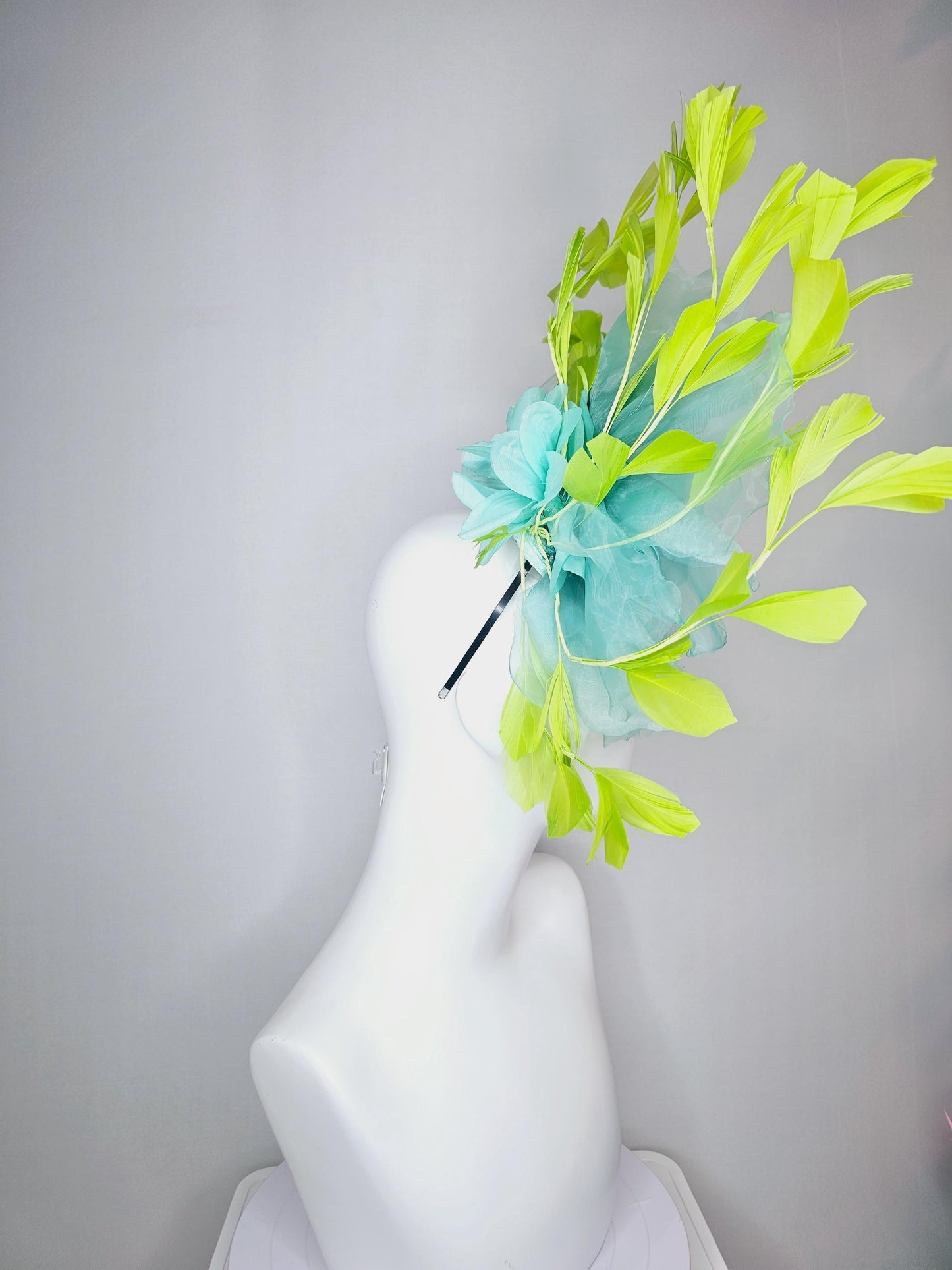kentucky derby fascinator black headband with very large baby blue organza silk flower and lime green branching feathers