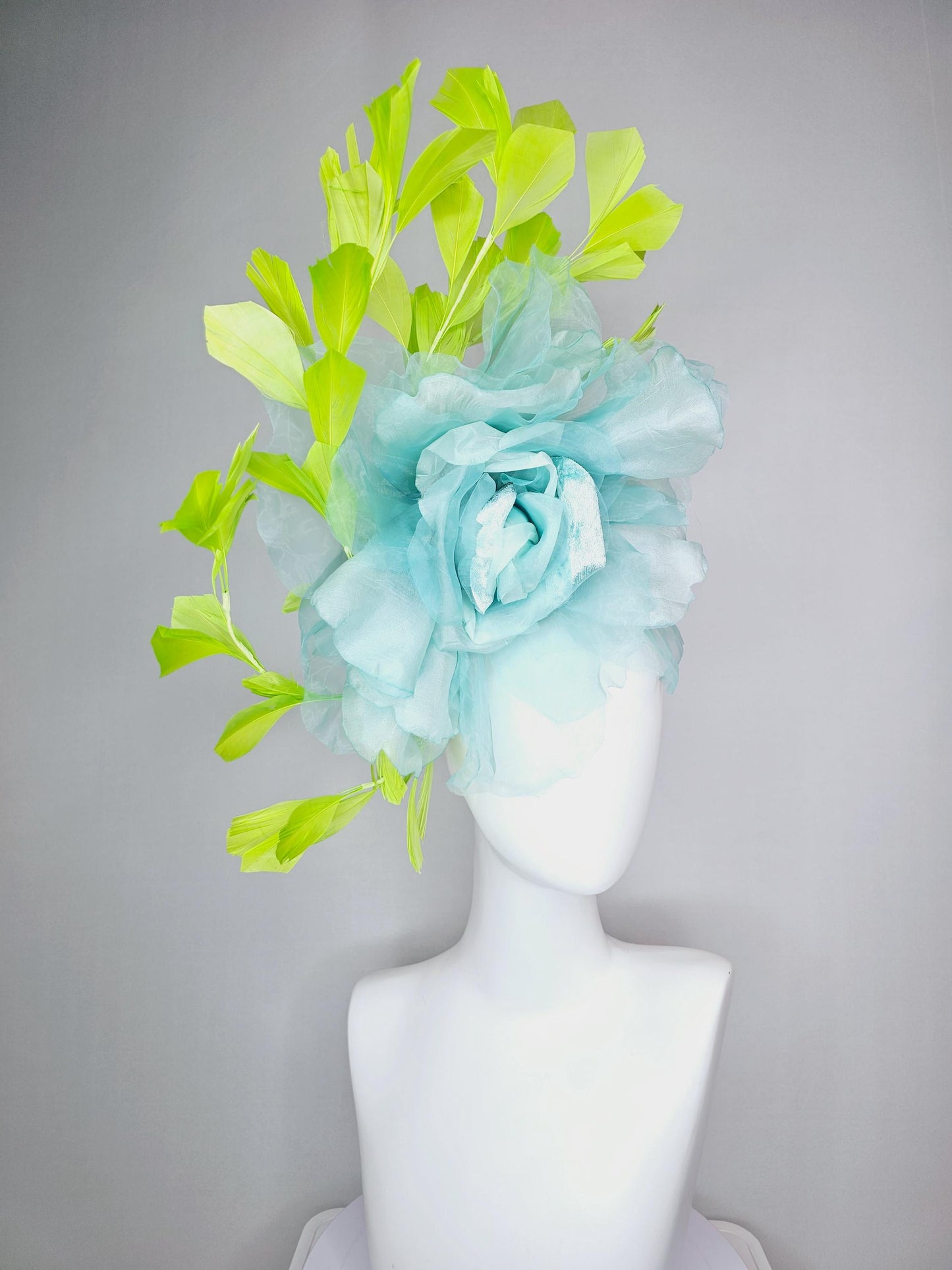 kentucky derby fascinator black headband with very large baby blue organza silk flower and lime green branching feathers