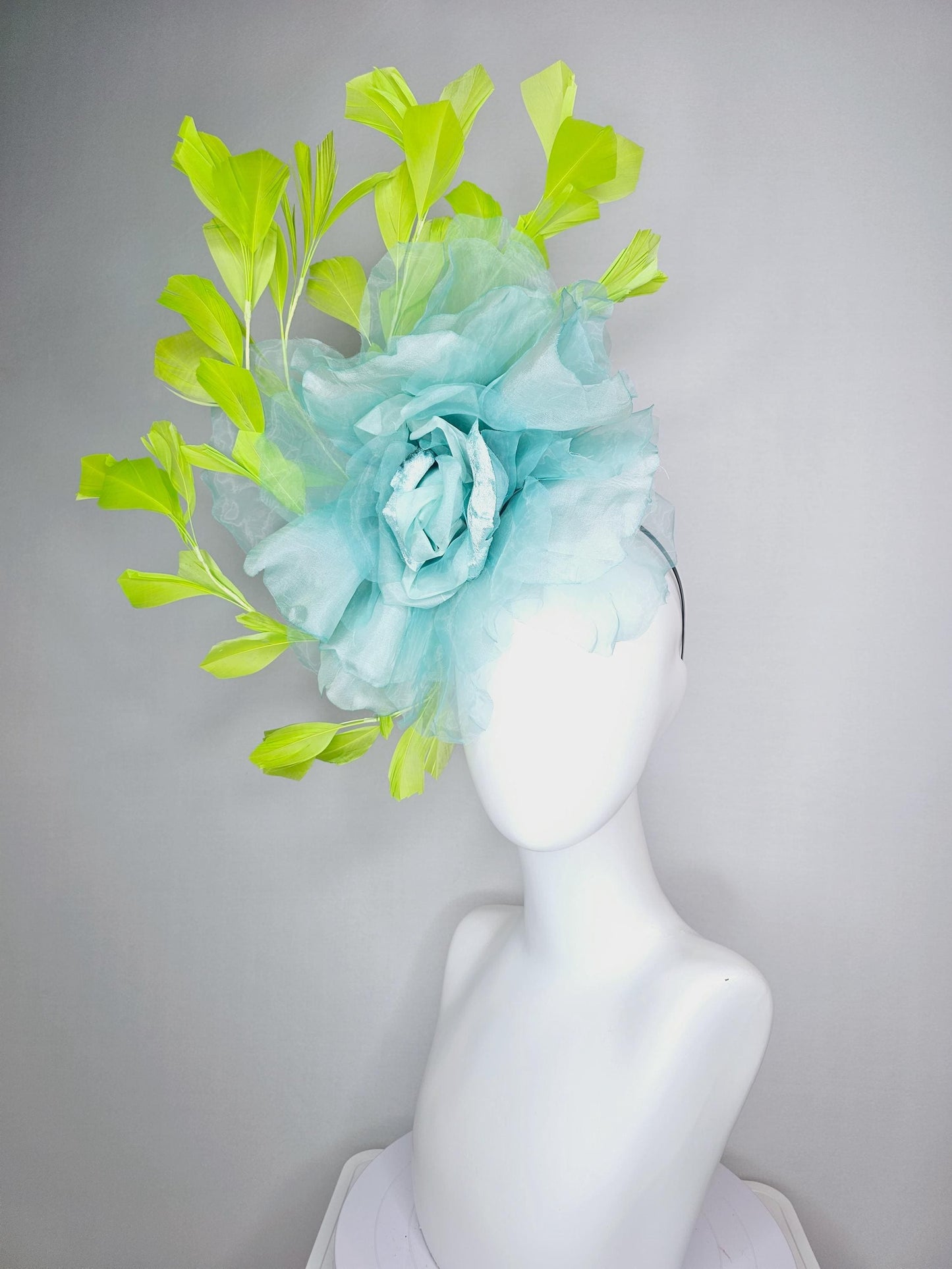 kentucky derby fascinator black headband with very large baby blue organza silk flower and lime green branching feathers