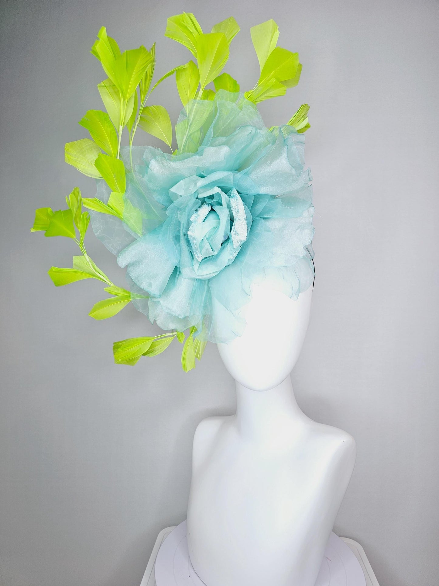kentucky derby fascinator black headband with very large baby blue organza silk flower and lime green branching feathers