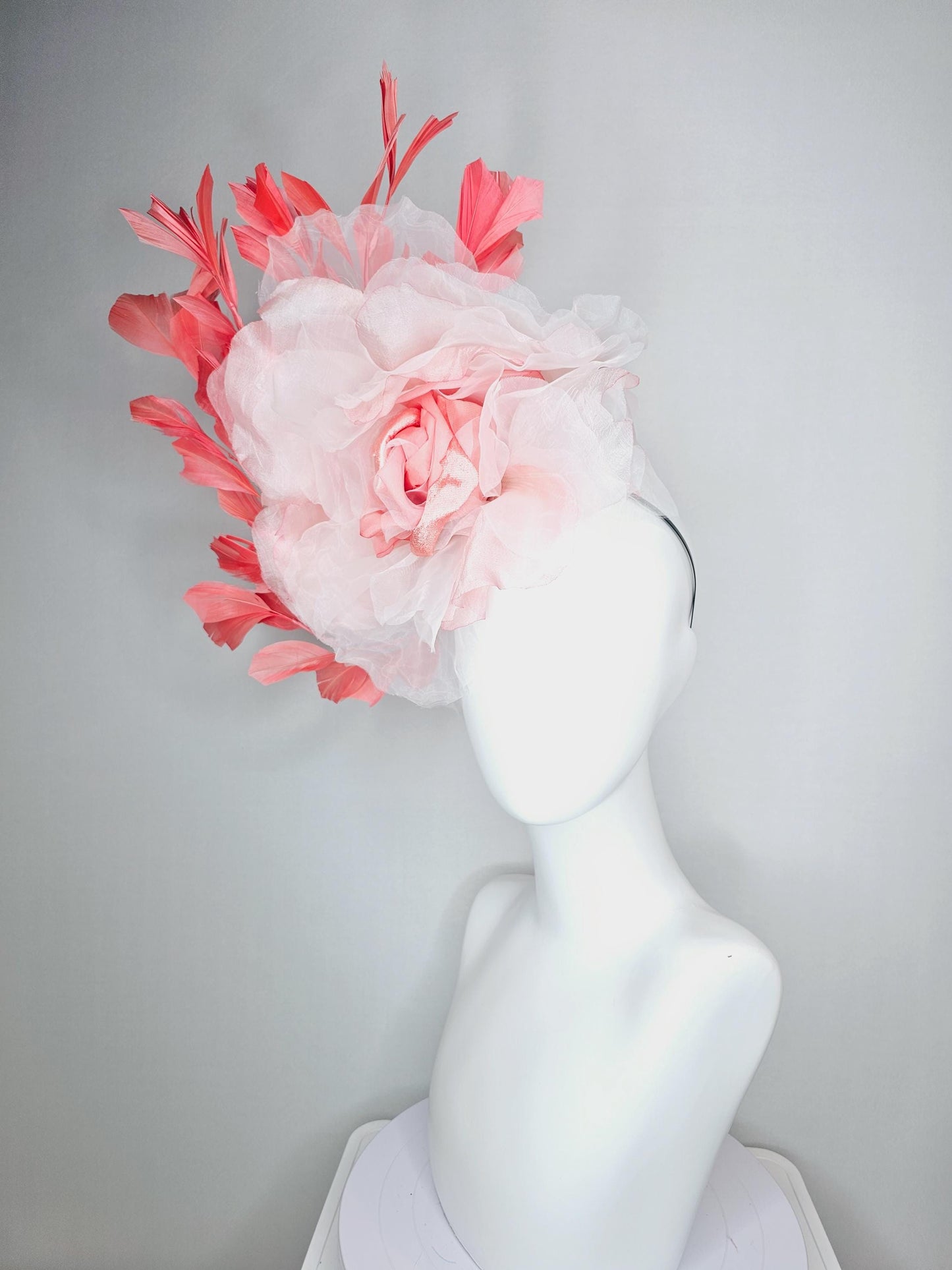 kentucky derby fascinator black headband with very large light pink organza silk flower and coral red branching feathers