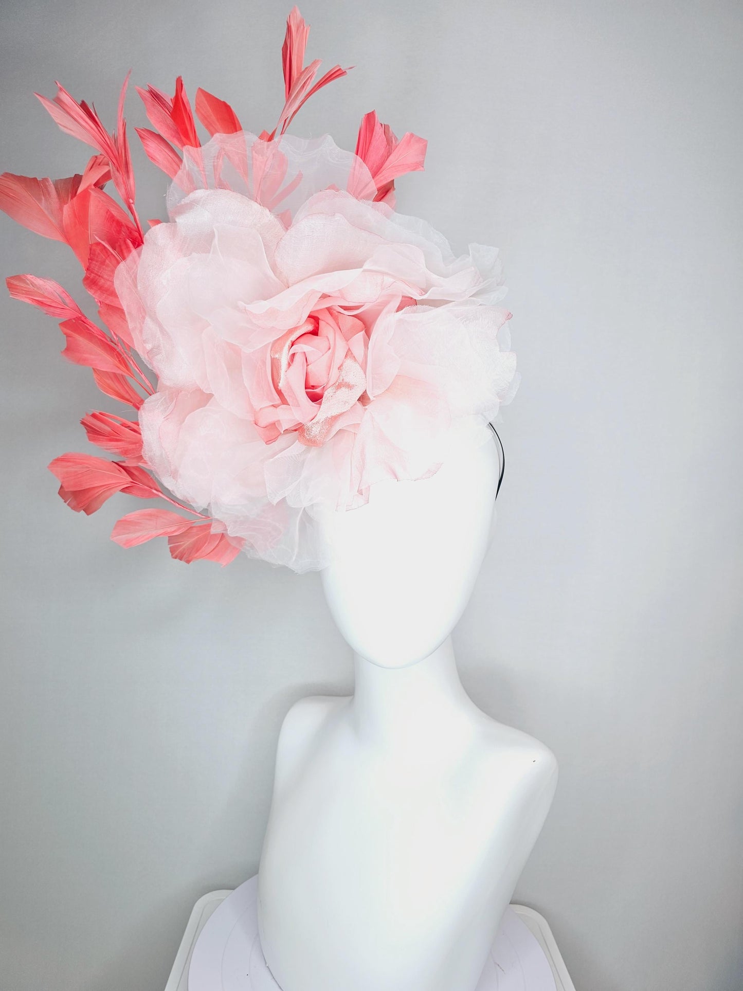 kentucky derby fascinator black headband with very large light pink organza silk flower and coral red branching feathers