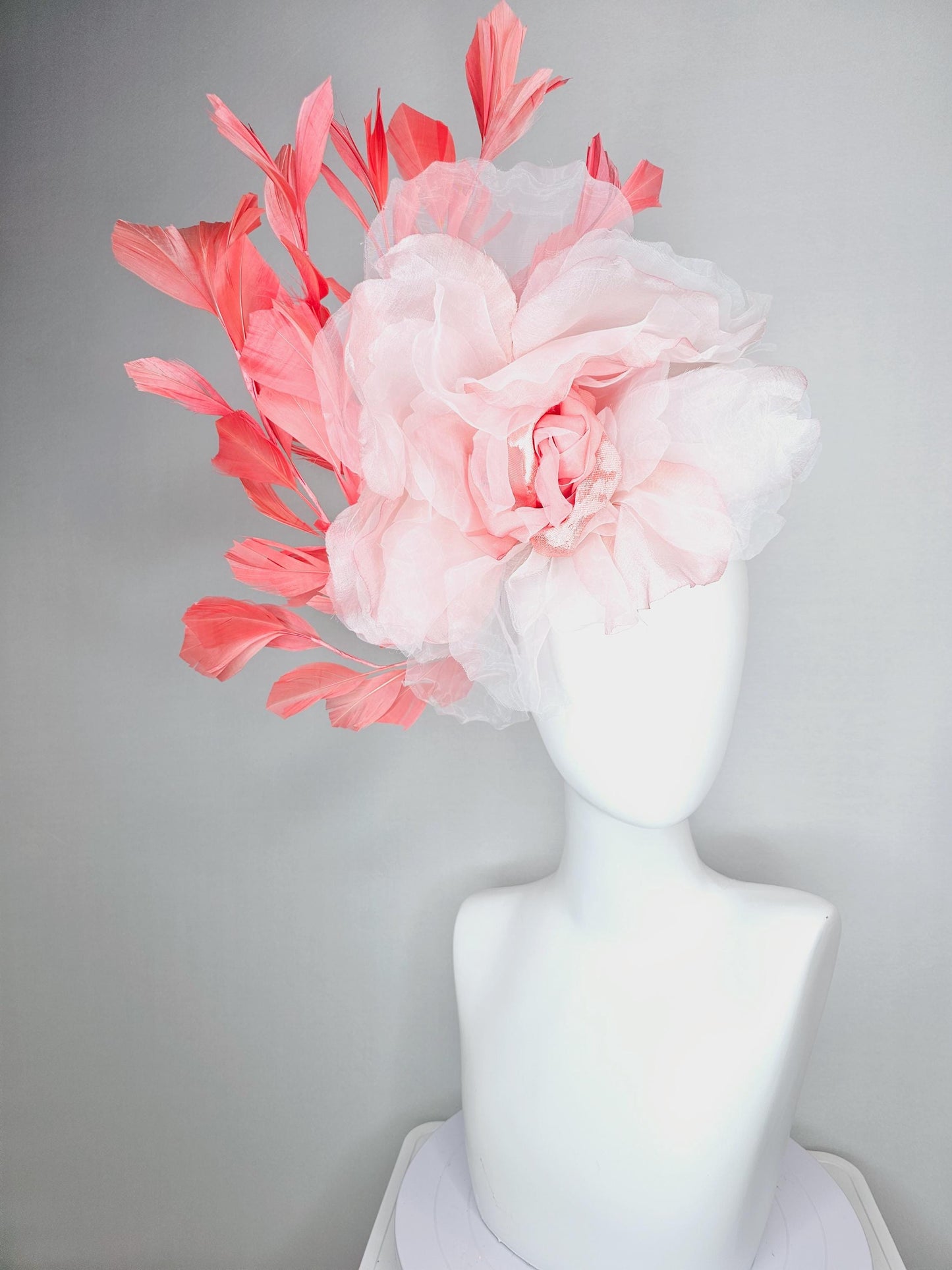 kentucky derby fascinator black headband with very large light pink organza silk flower and coral red branching feathers