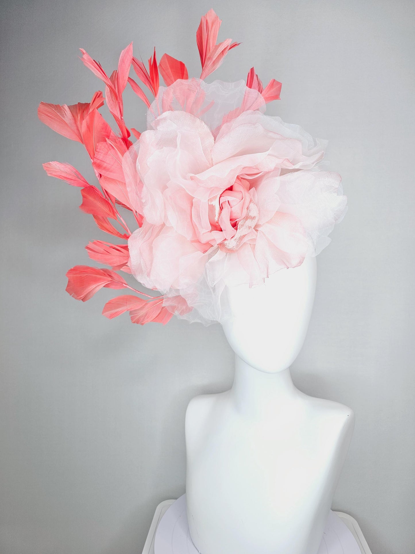 kentucky derby fascinator black headband with very large light pink organza silk flower and coral red branching feathers