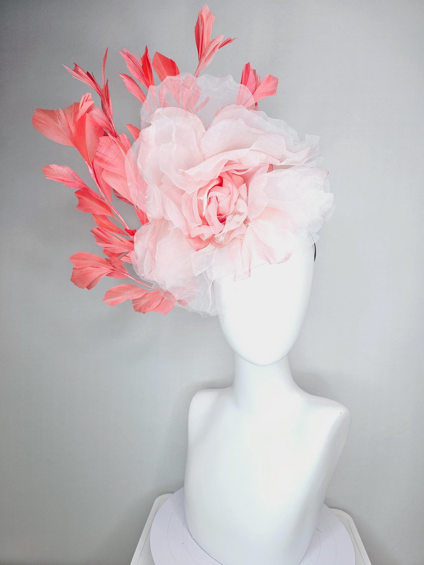 kentucky derby fascinator black headband with very large light pink organza silk flower and coral red branching feathers
