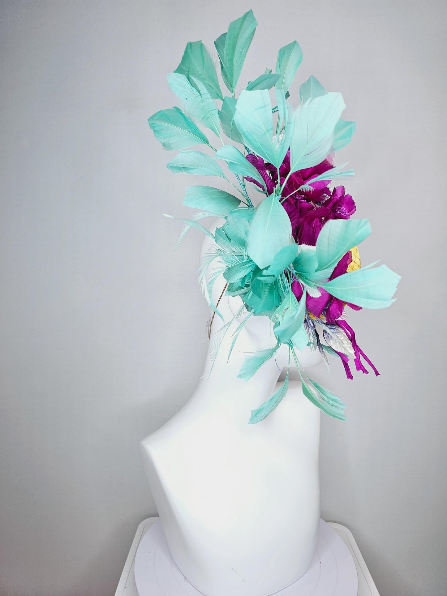 kentucky derby hat fascinator yellow gold satin with netting fuchsia pink organza satin flowers ombre blue leaves mint green feathers