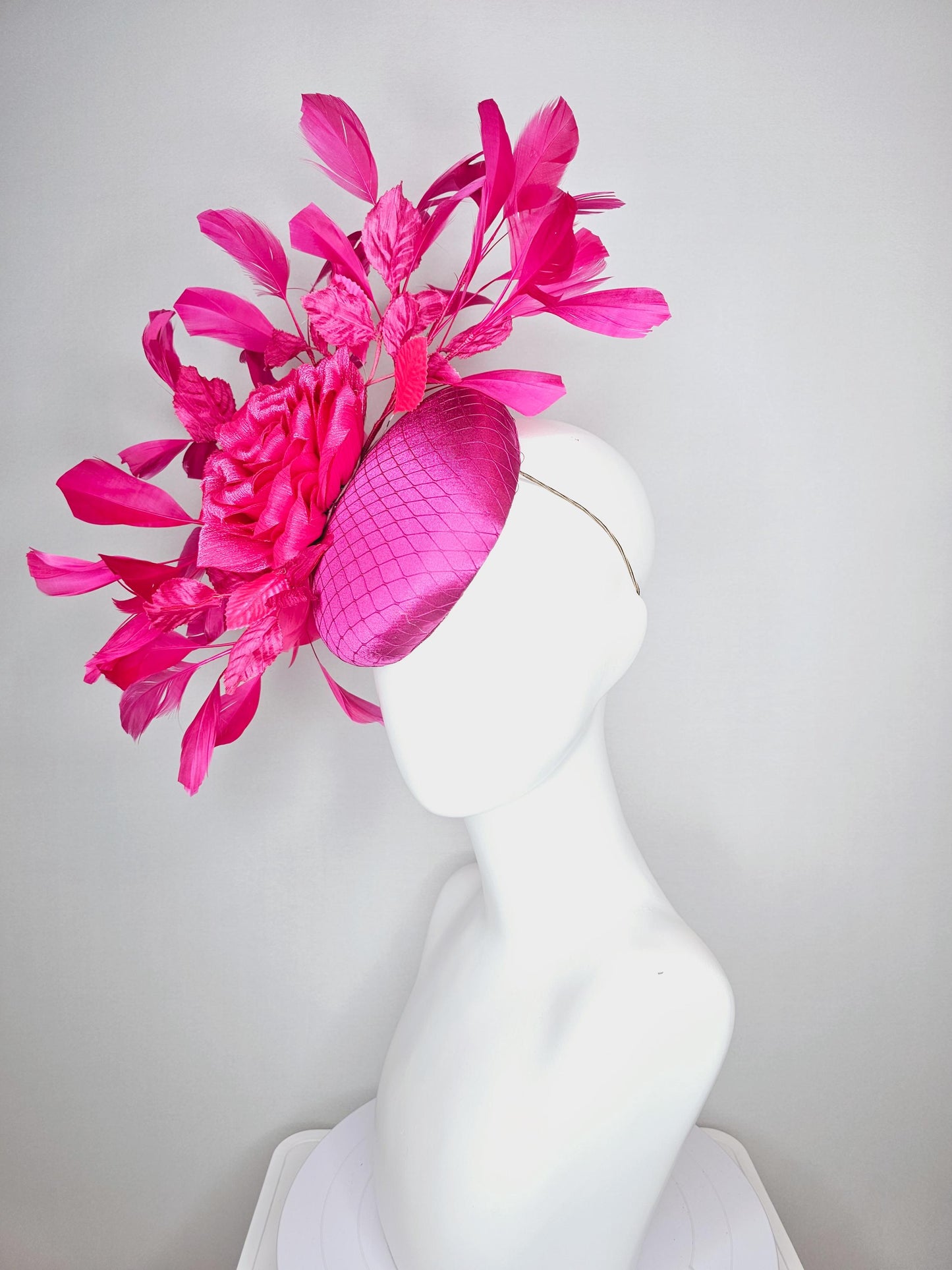 kentucky derby hat fascinator fuchsia pink satin with netting hot bright pink satin rose flower pink leaves bright pink branching feathers
