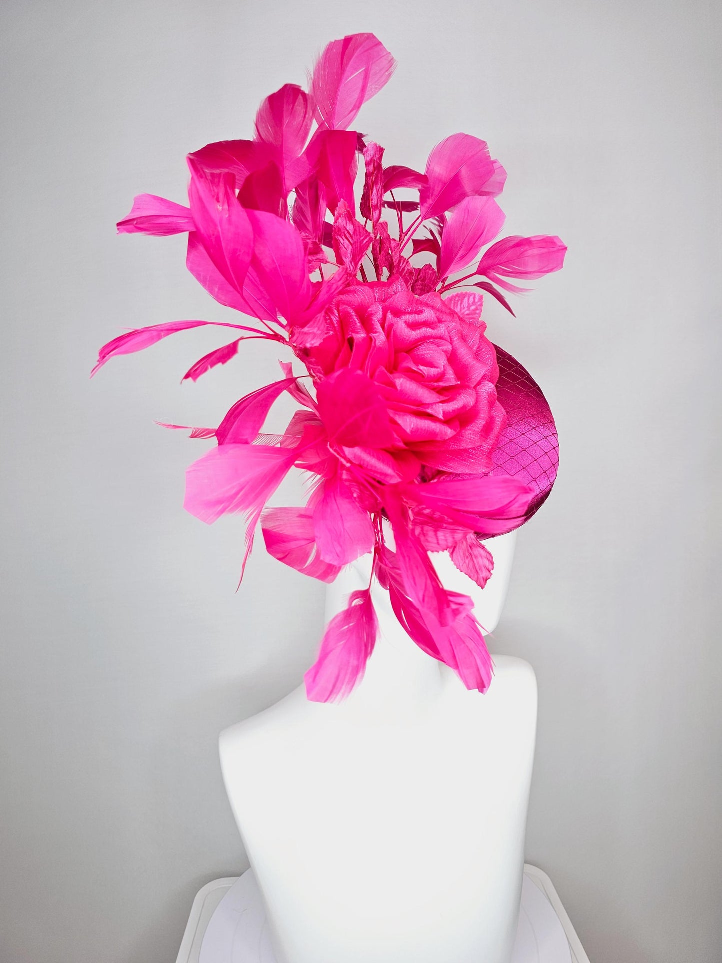 kentucky derby hat fascinator fuchsia pink satin with netting hot bright pink satin rose flower pink leaves bright pink branching feathers