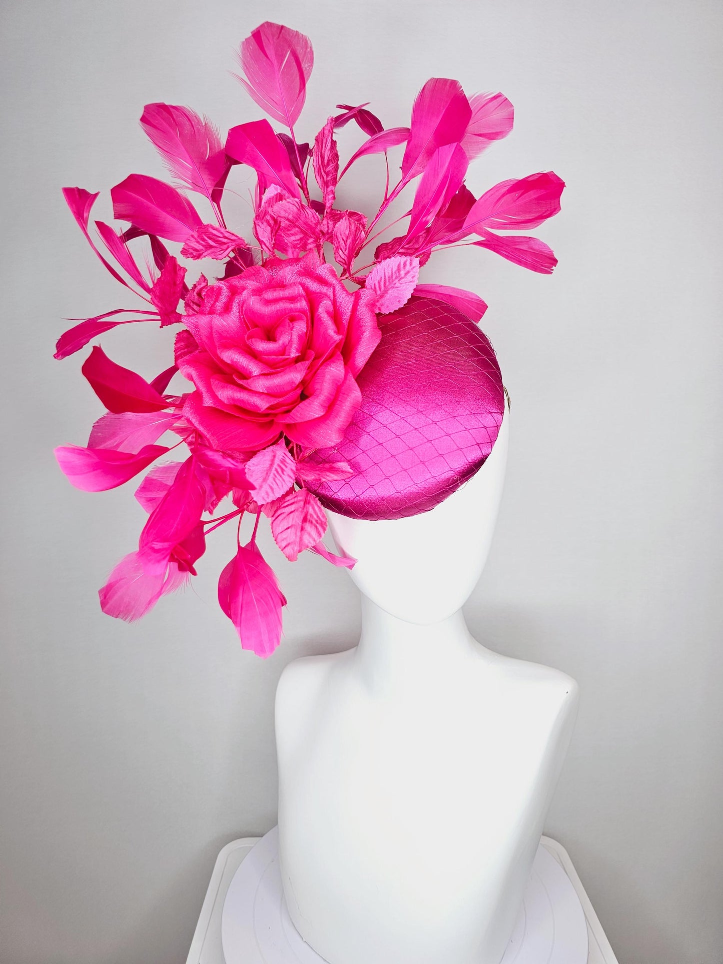 kentucky derby hat fascinator fuchsia pink satin with netting hot bright pink satin rose flower pink leaves bright pink branching feathers