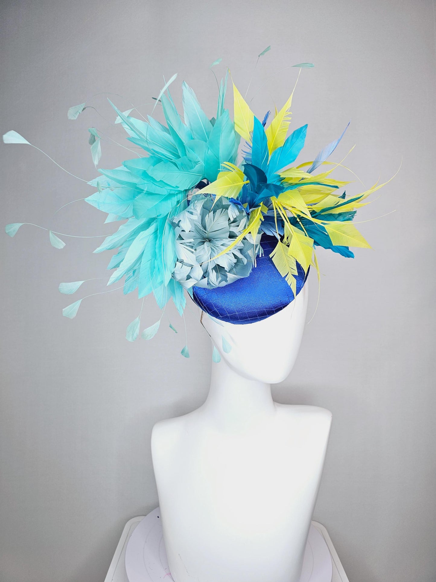 kentucky derby hat fascinator royal blue satin with netting light blue fluffy feather flower turquoise teal and yellow branching feathers