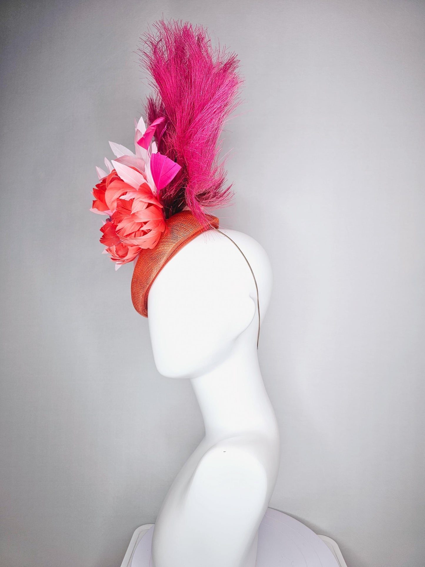 kentucky derby hat fascinator pointed burnt orange sinamay with light pink red orange feather flowers pink feathers hot pink pampas grass