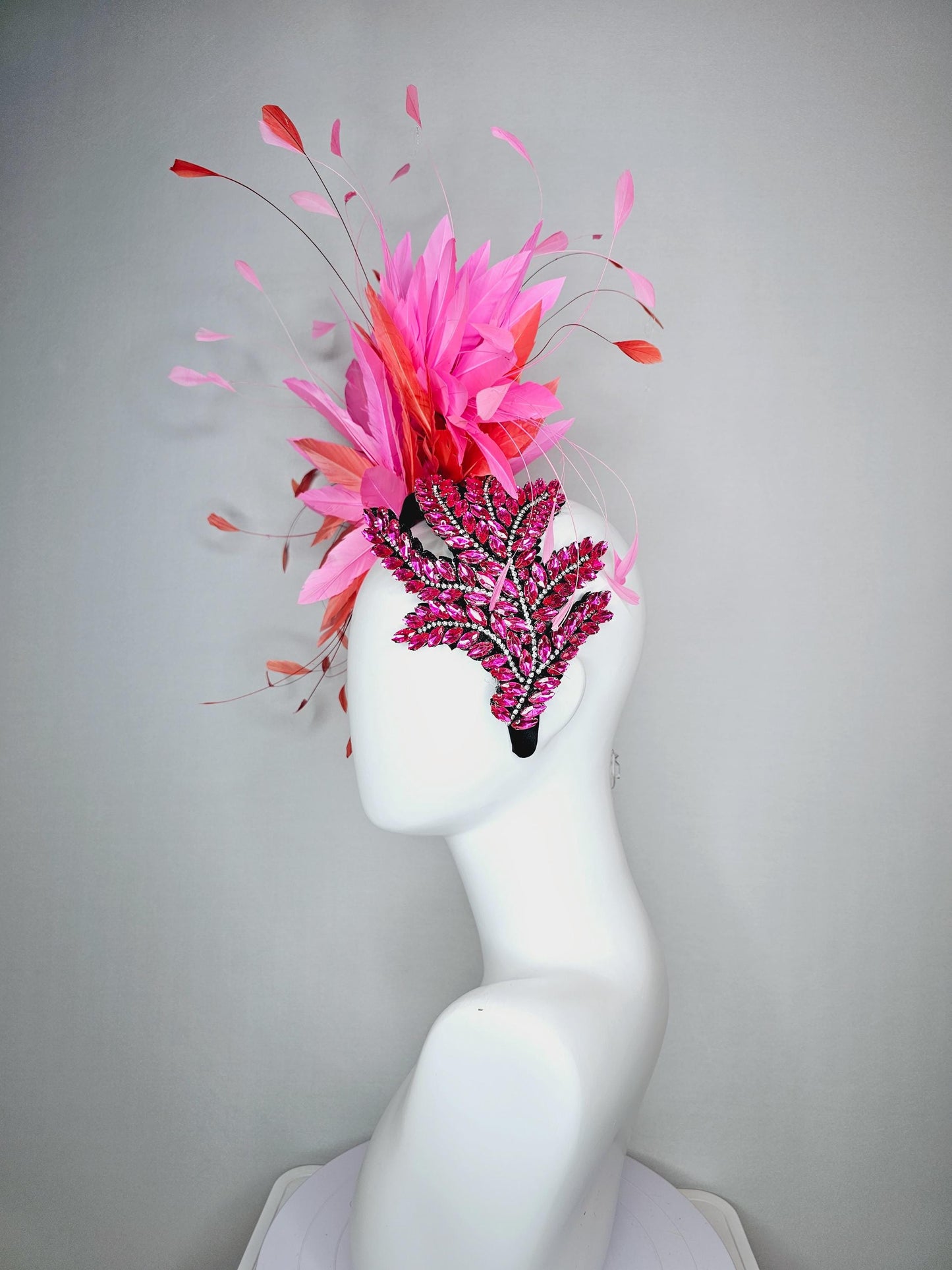 kentucky derby hat fascinator black headband with large pink crystal rhinestone beaded stems and blush pink coral orange branching feathers