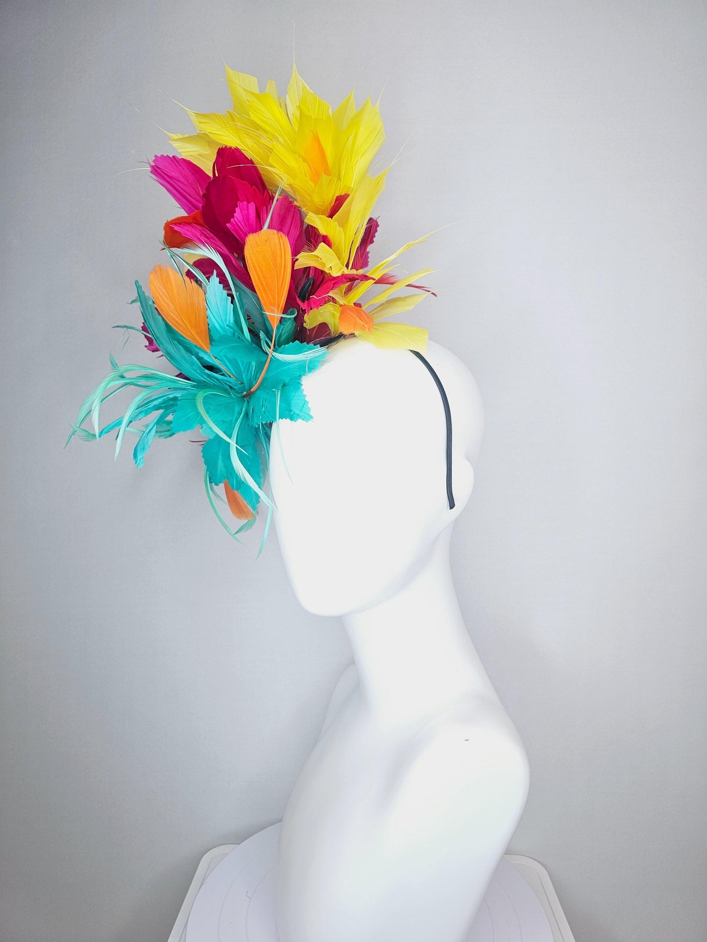 kentucky derby hat fascinator colorful fluffy aqua blue zigzag feather flower and hot pink fuchsia cherry red yellow branching feathers