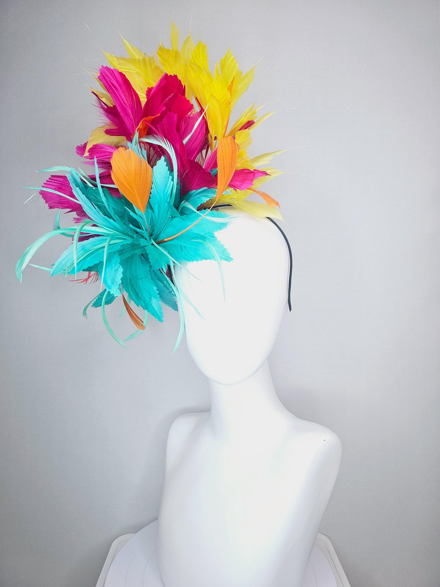 kentucky derby hat fascinator colorful fluffy aqua blue zigzag feather flower and hot pink fuchsia cherry red yellow branching feathers