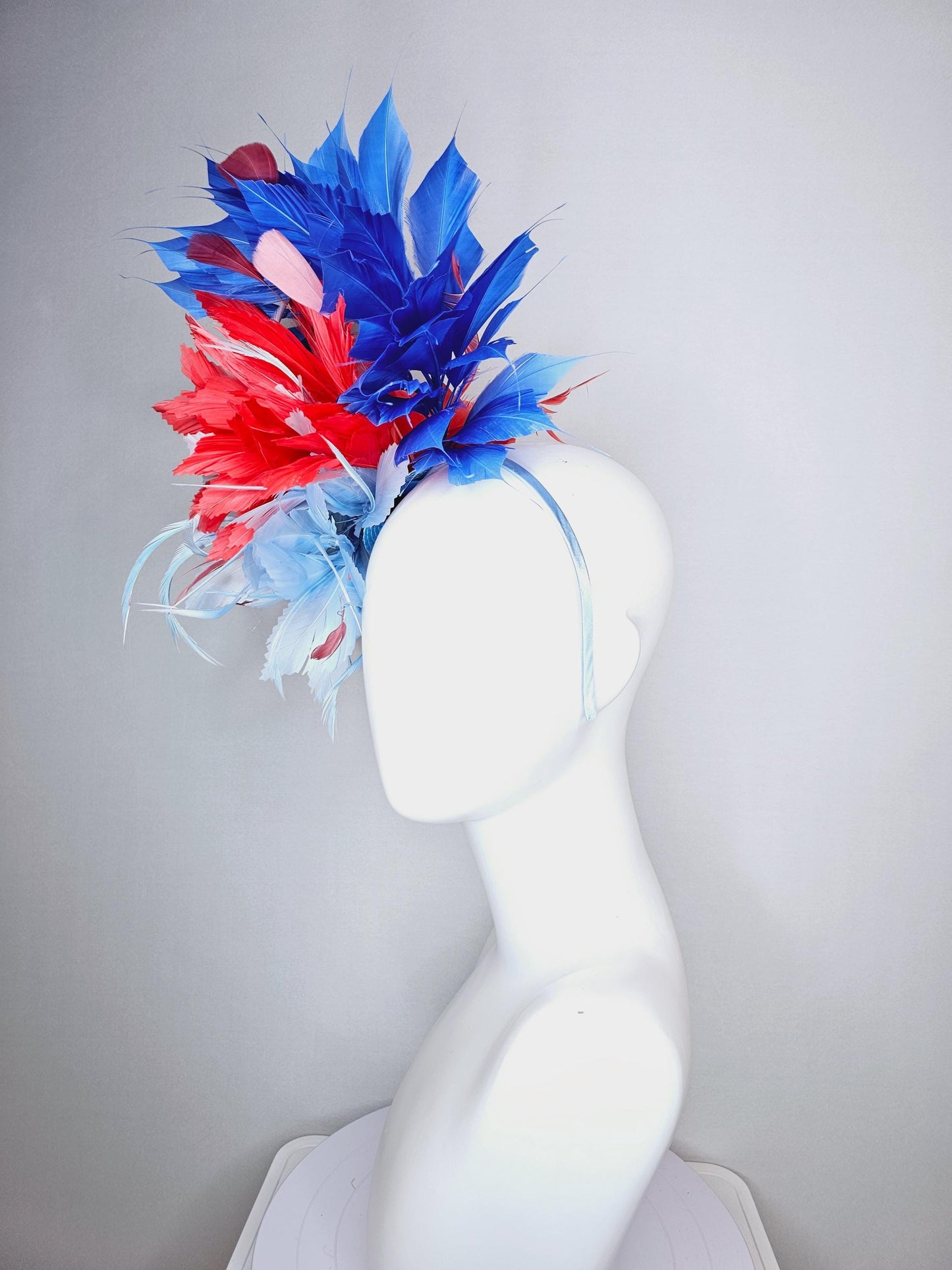 kentucky derby hat fascinator fluffy light blue zigzag feather flower and coral red royal cobalt blue baby blue branching feathers