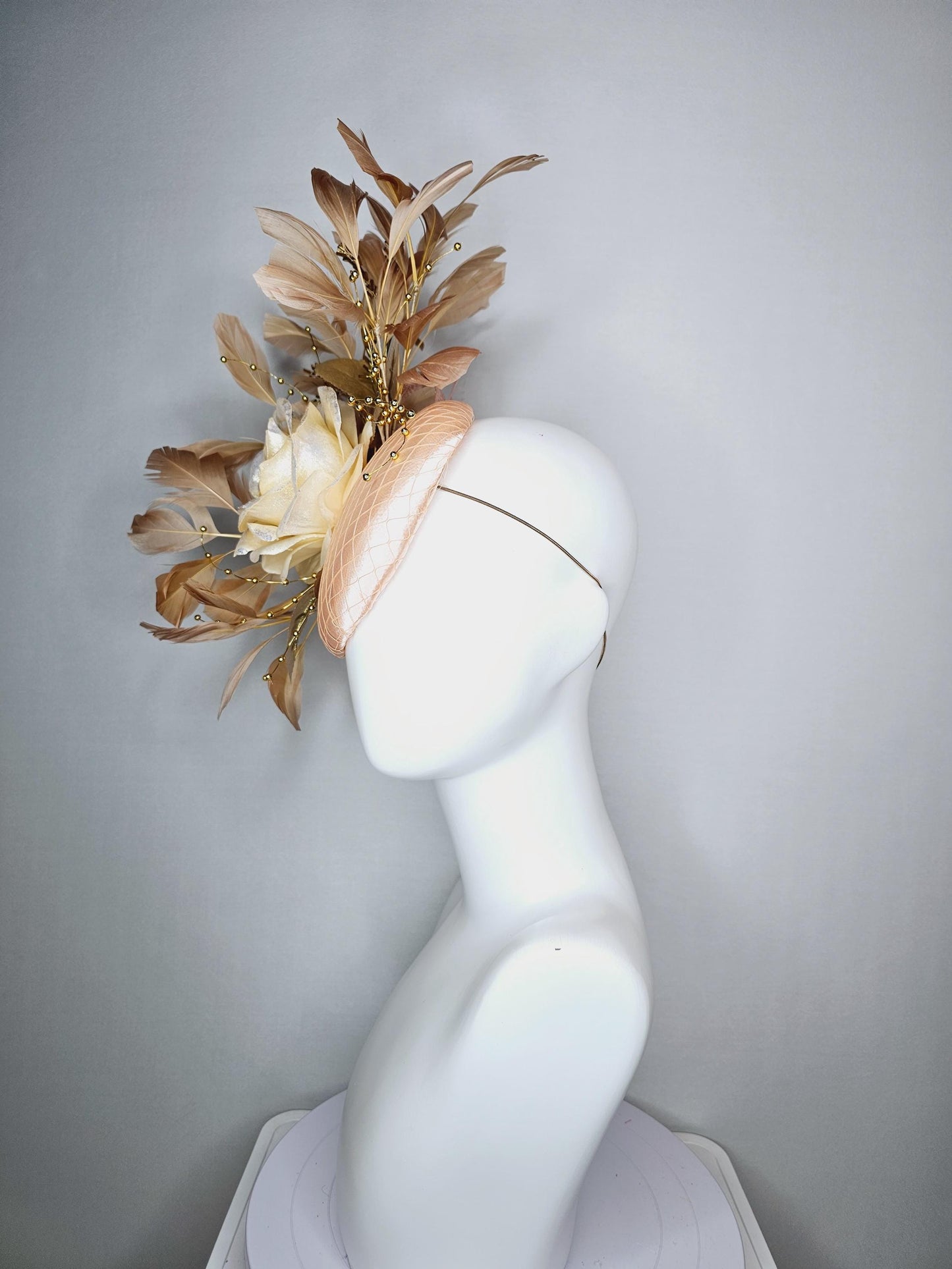 kentucky derby hat fascinator champagne pink satin with netting neutral cream satin rose flower gold leaves tan beige branching feathers