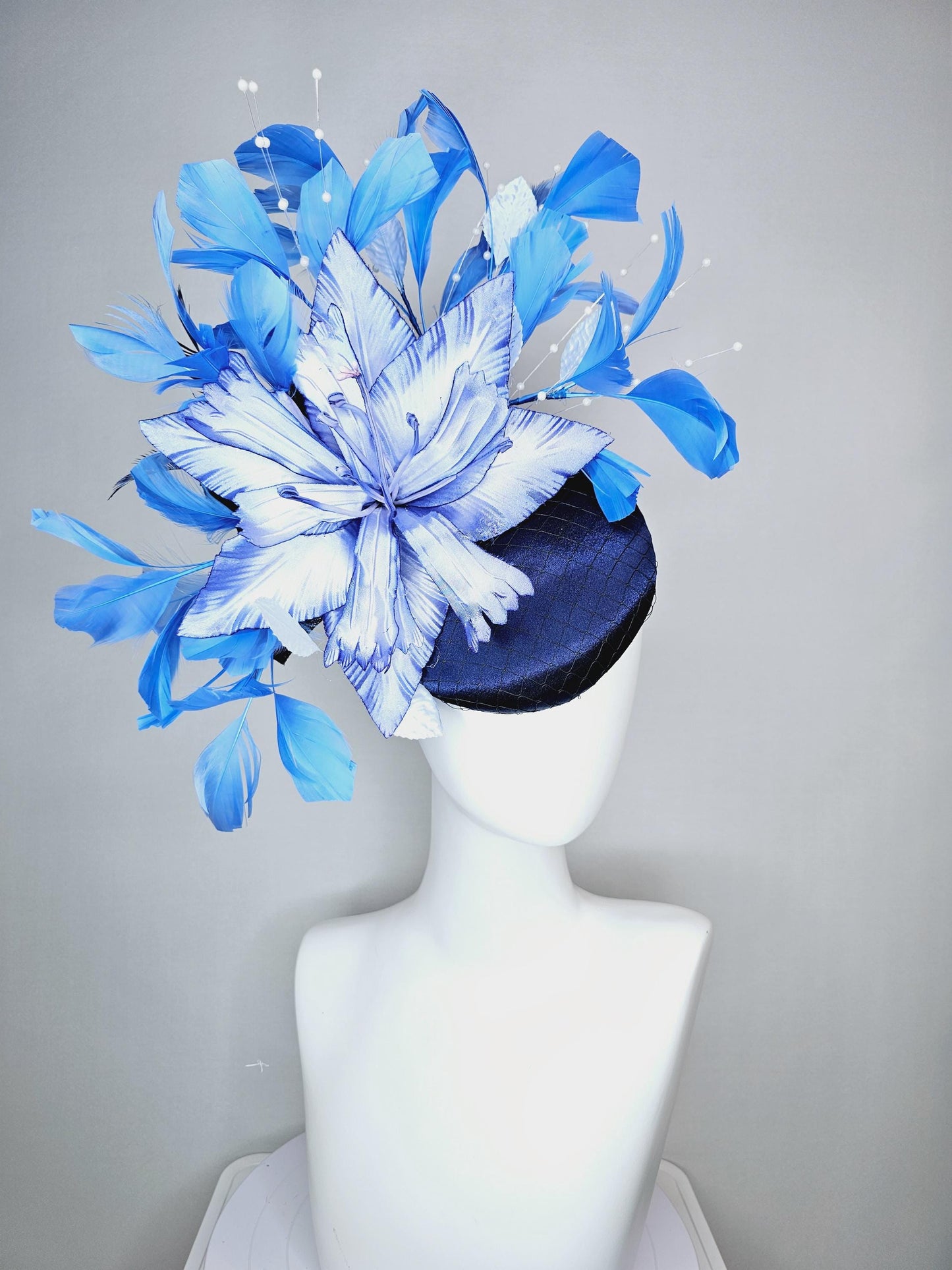 kentucky derby hat fascinator navy blue satin with netting large ombre blue satin flower white leaves navy blue sky blue branching feathers