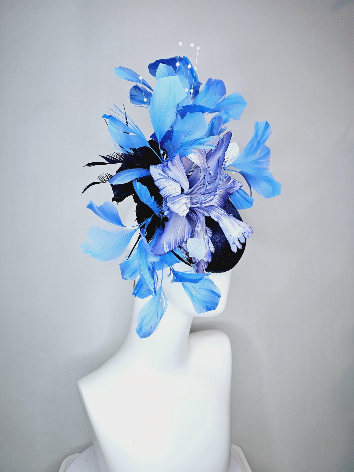 kentucky derby hat fascinator navy blue satin with netting large ombre blue satin flower white leaves navy blue sky blue branching feathers