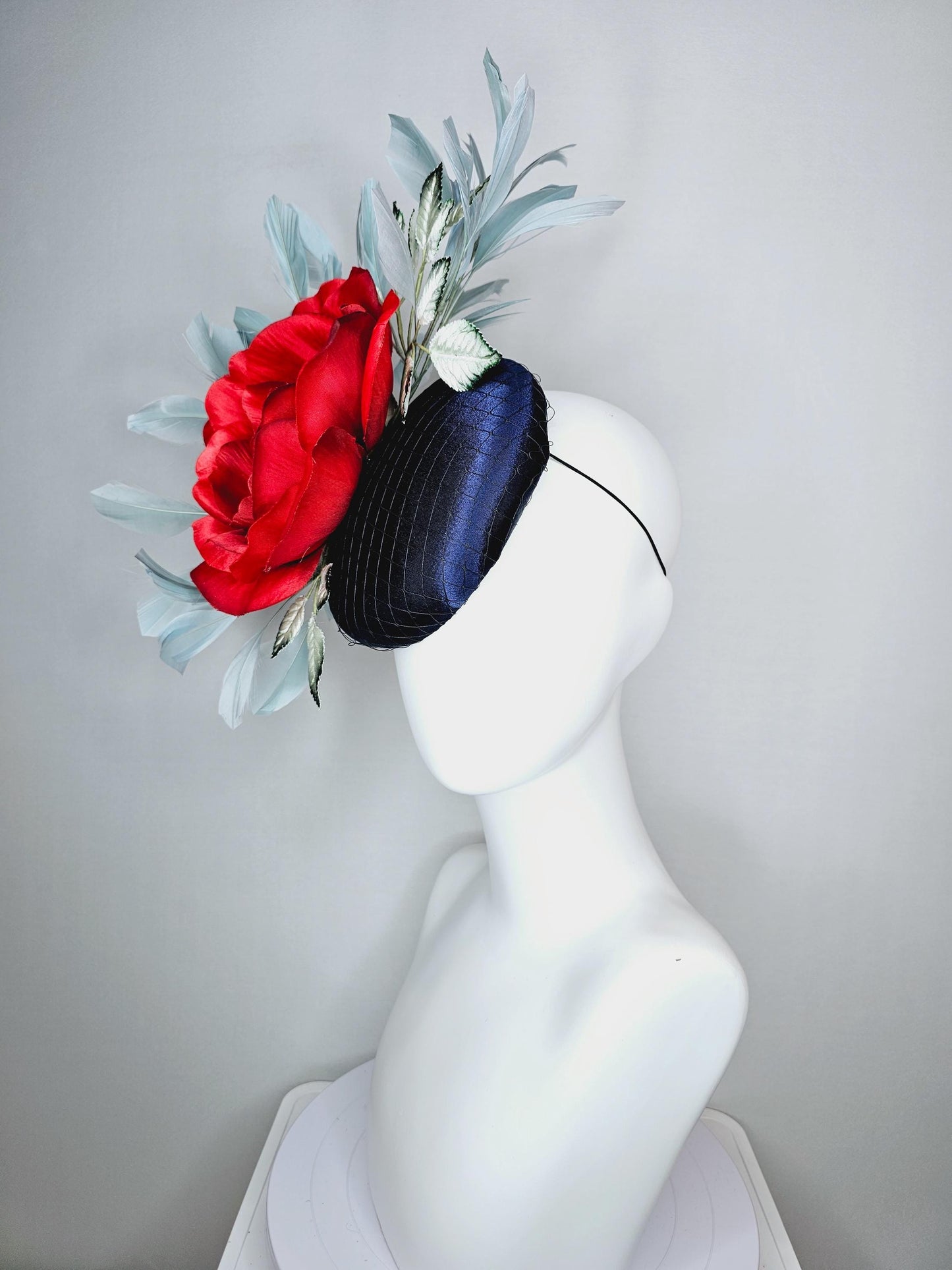 kentucky derby hat fascinator navy blue satin with netting red satin rose flower ombre green leaves with light teal blue branching feathers
