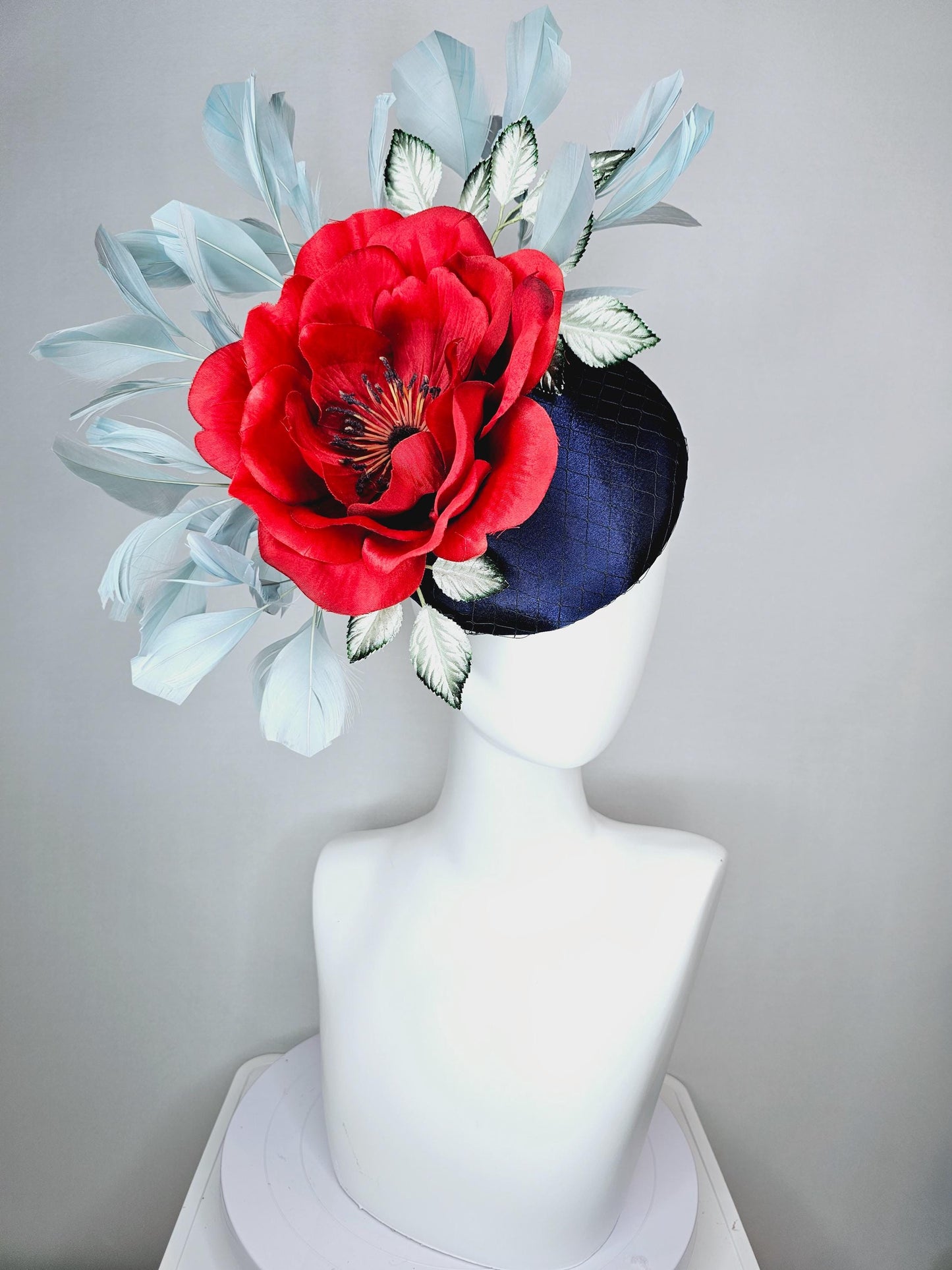 kentucky derby hat fascinator navy blue satin with netting red satin rose flower ombre green leaves with light teal blue branching feathers