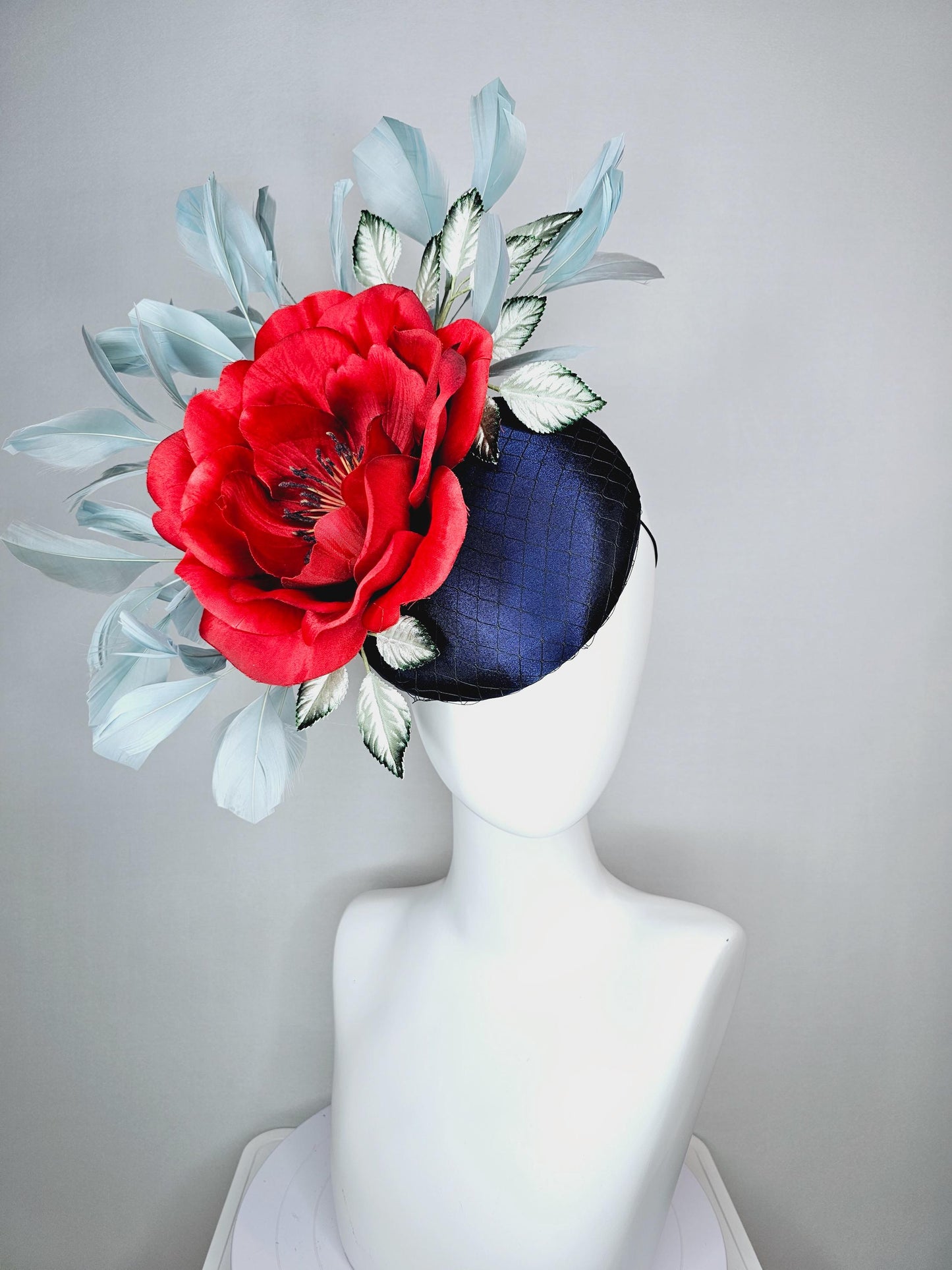 kentucky derby hat fascinator navy blue satin with netting red satin rose flower ombre green leaves with light teal blue branching feathers