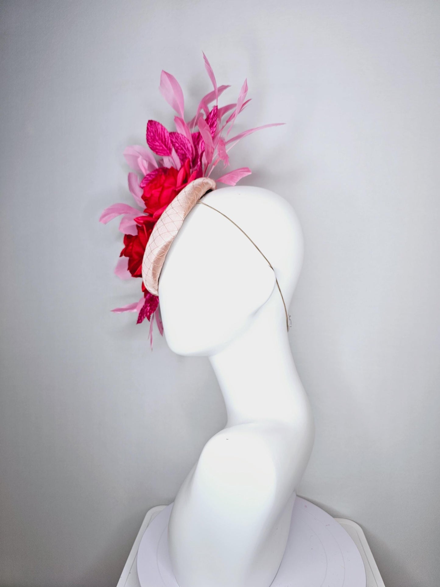 kentucky derby hat fascinator champagne pink satin with netting red satin rose flowers pink leaves and baby blush pink branching feathers