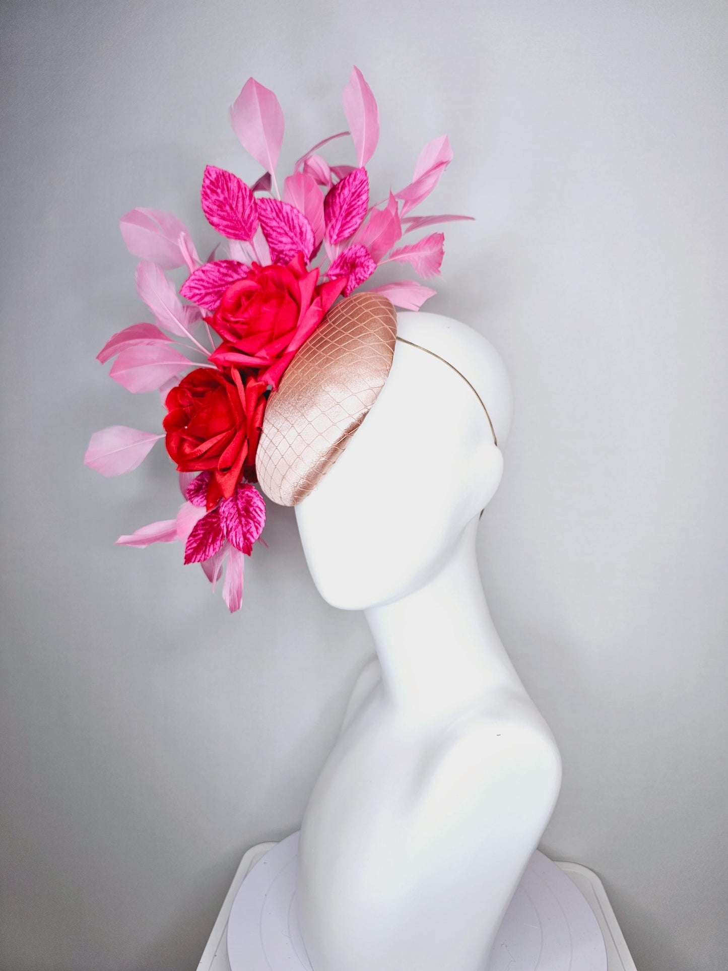 kentucky derby hat fascinator champagne pink satin with netting red satin rose flowers pink leaves and baby blush pink branching feathers