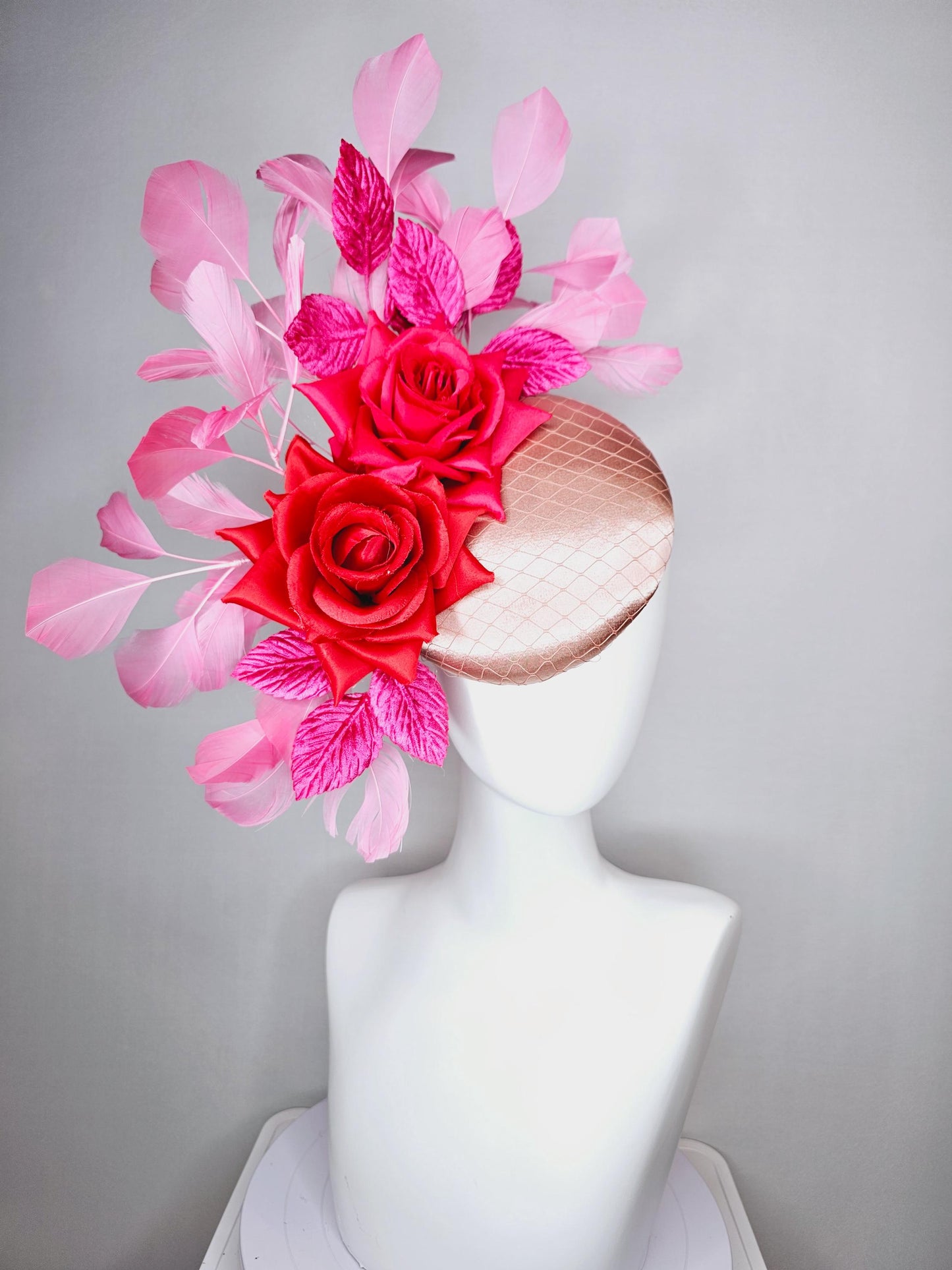 kentucky derby hat fascinator champagne pink satin with netting red satin rose flowers pink leaves and baby blush pink branching feathers