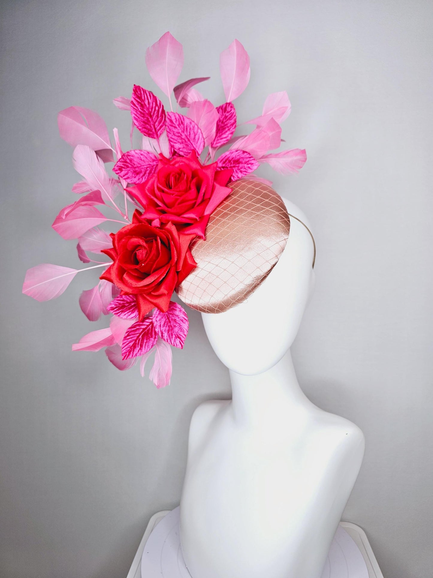 kentucky derby hat fascinator champagne pink satin with netting red satin rose flowers pink leaves and baby blush pink branching feathers