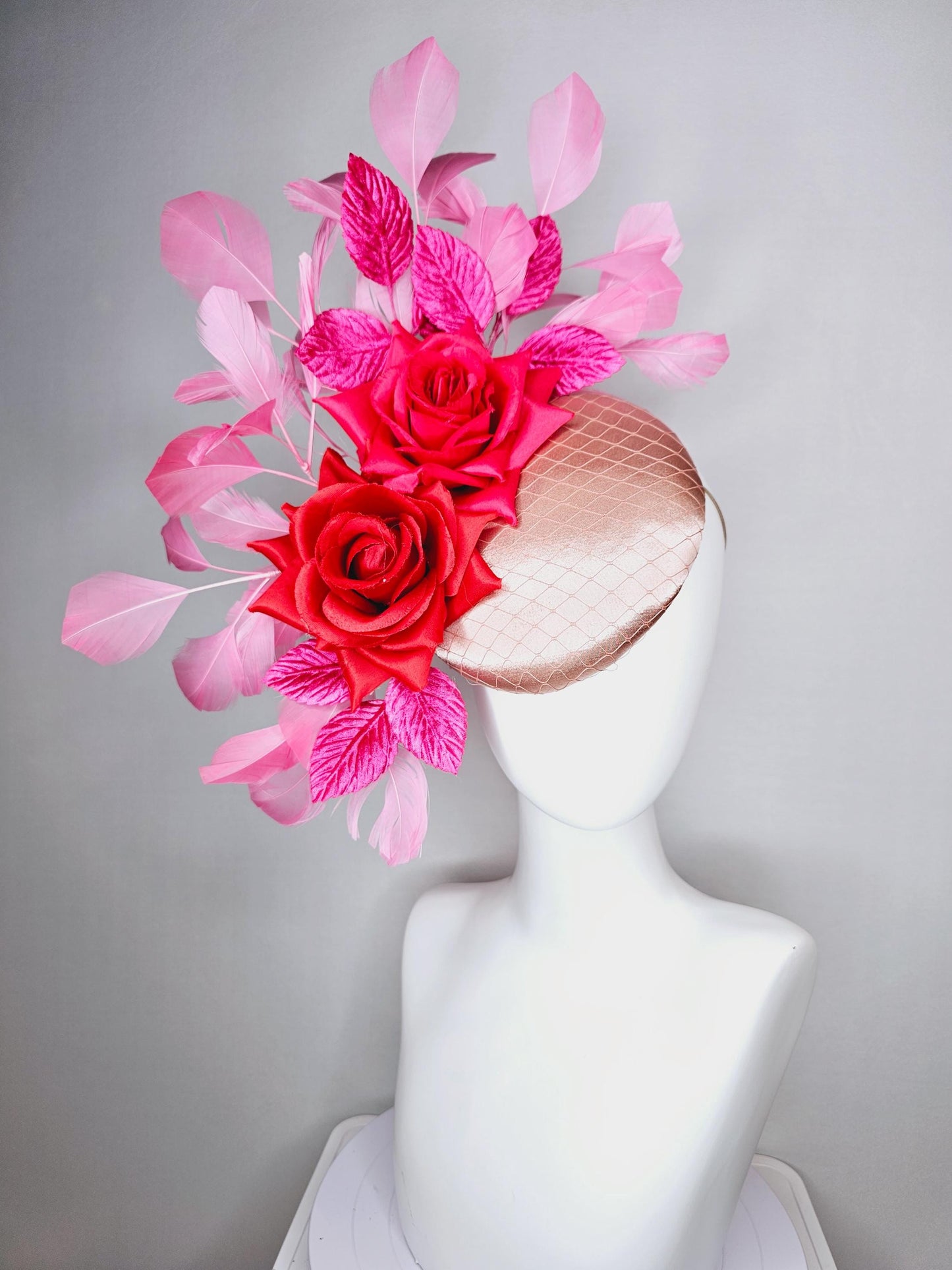 kentucky derby hat fascinator champagne pink satin with netting red satin rose flowers pink leaves and baby blush pink branching feathers