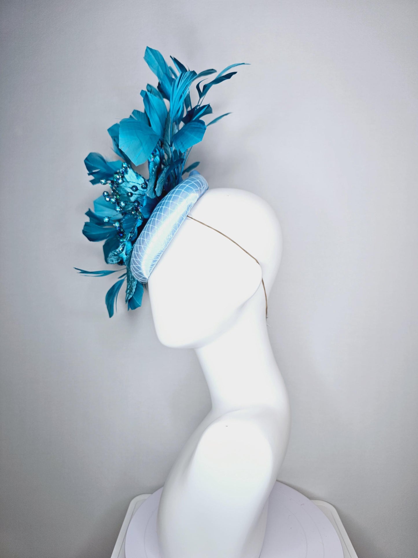 kentucky derby hat fascinator baby blue satin with netting large sky blue satin flower with sequin and leaves turquoise blue feathers
