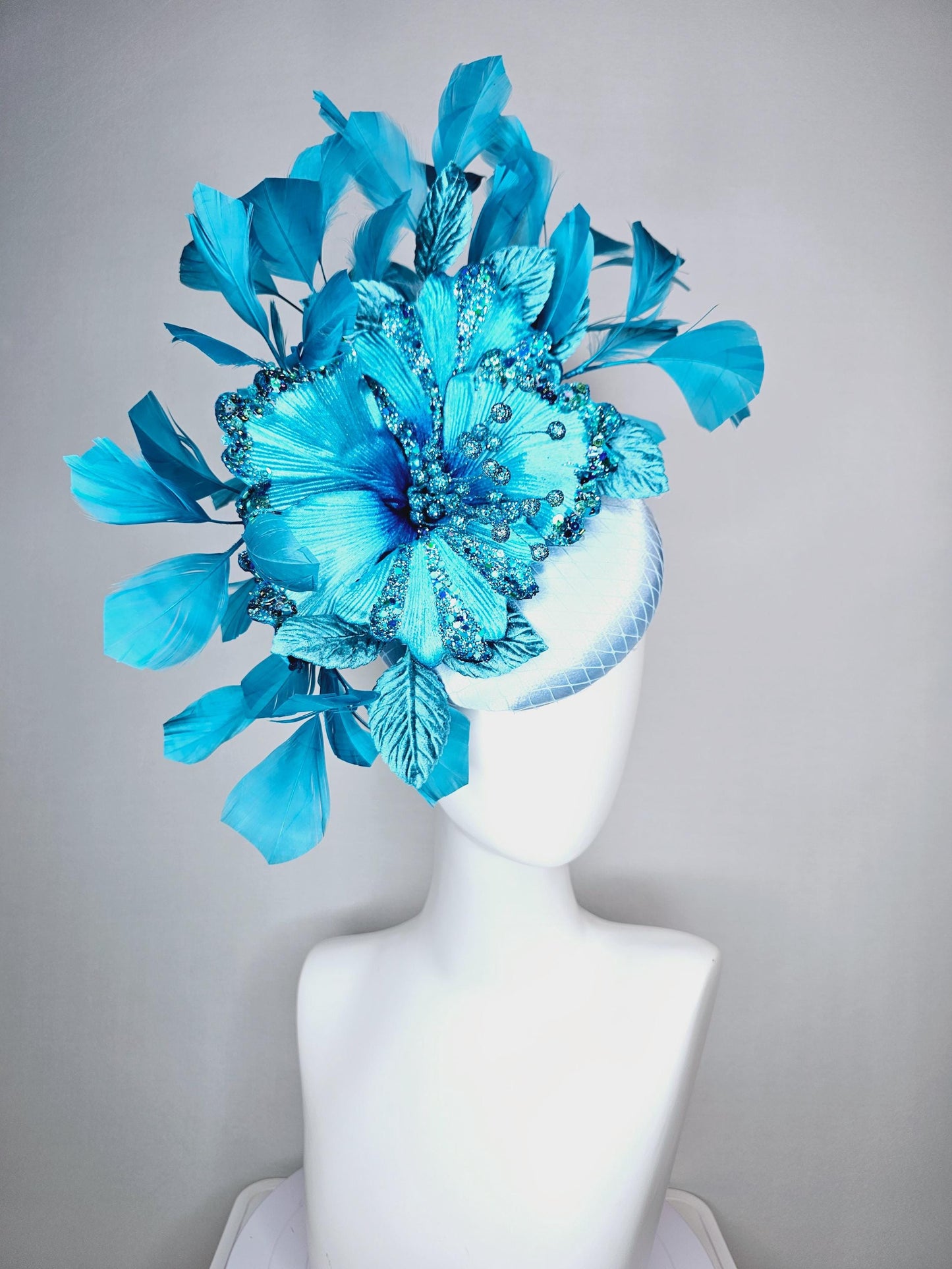 kentucky derby hat fascinator baby blue satin with netting large sky blue satin flower with sequin and leaves turquoise blue feathers