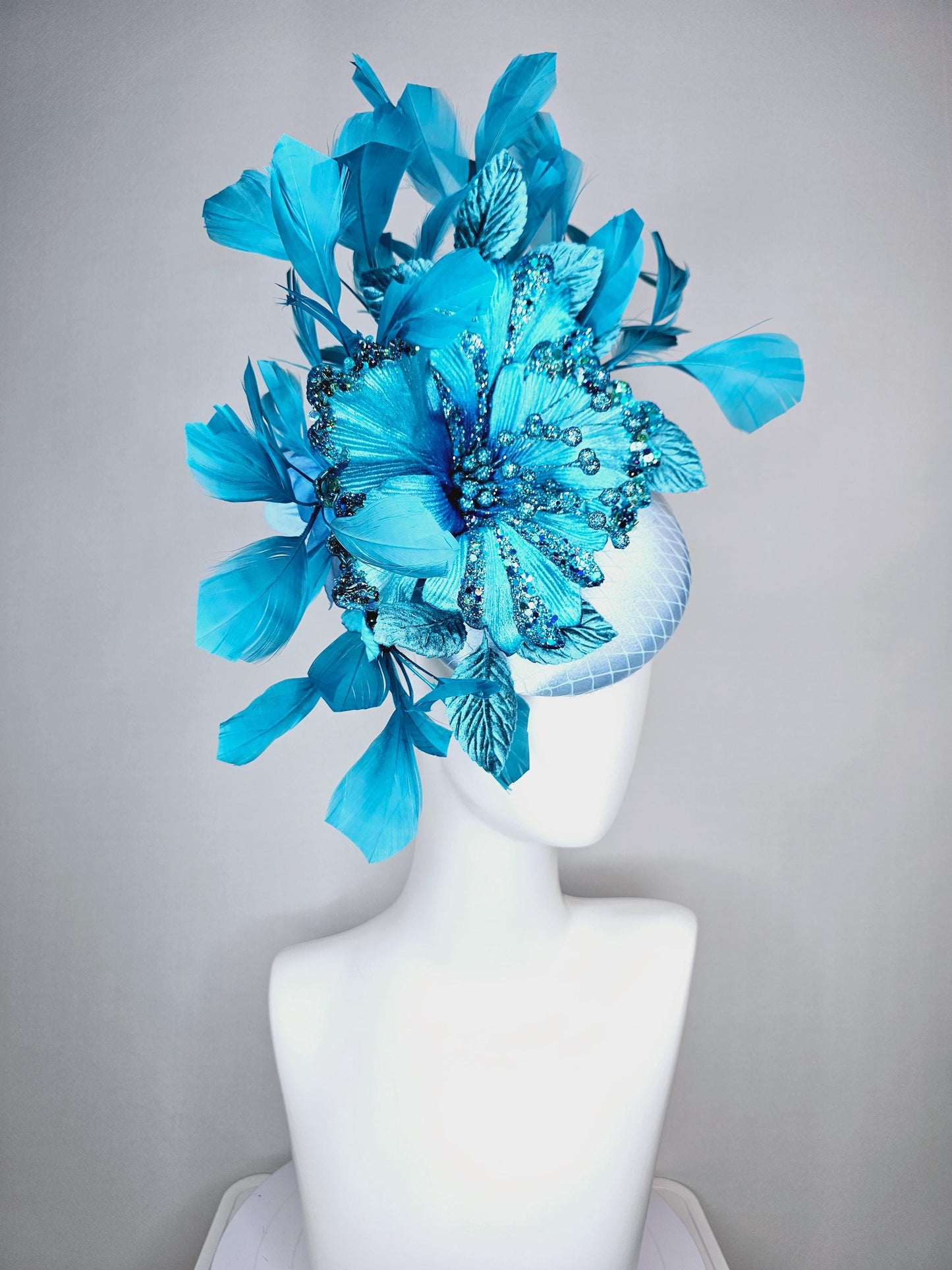 kentucky derby hat fascinator baby blue satin with netting large sky blue satin flower with sequin and leaves turquoise blue feathers