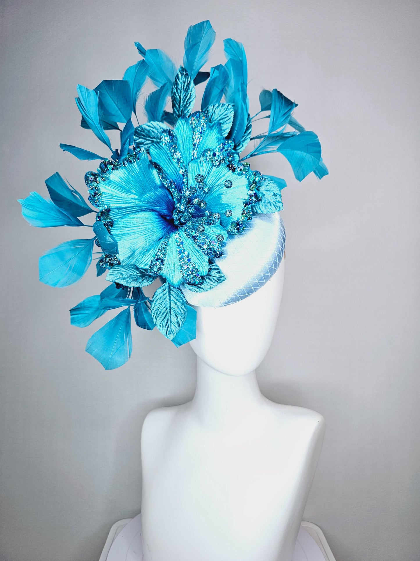 kentucky derby hat fascinator baby blue satin with netting large sky blue satin flower with sequin and leaves turquoise blue feathers