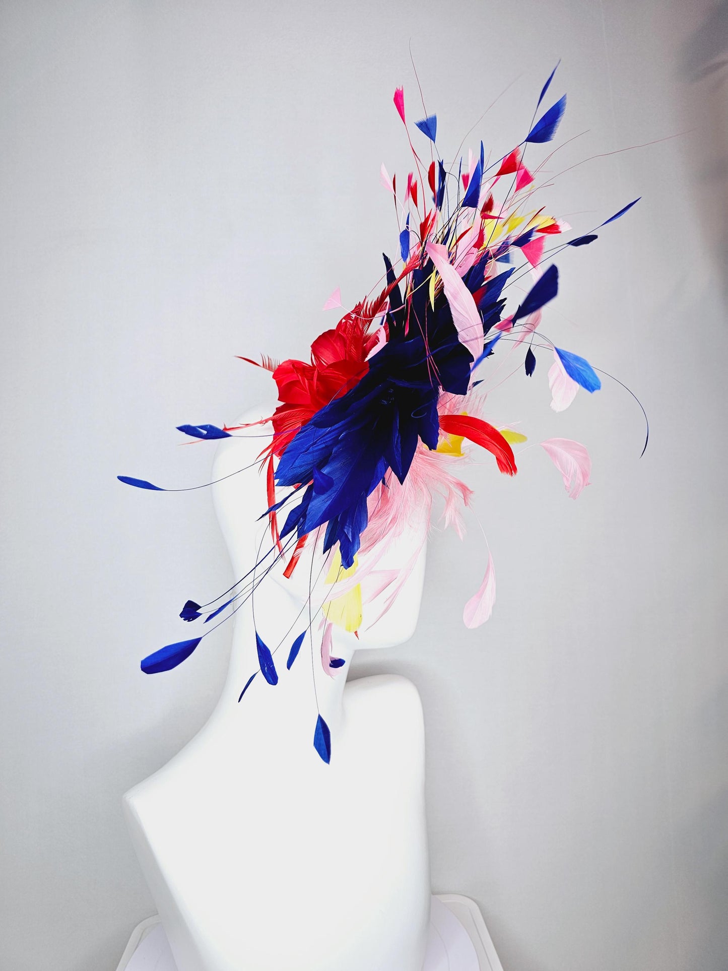 kentucky derby hat fascinator light pink and red feather flowers with colorful light pink yellow royal cobalt blue red branching feathers