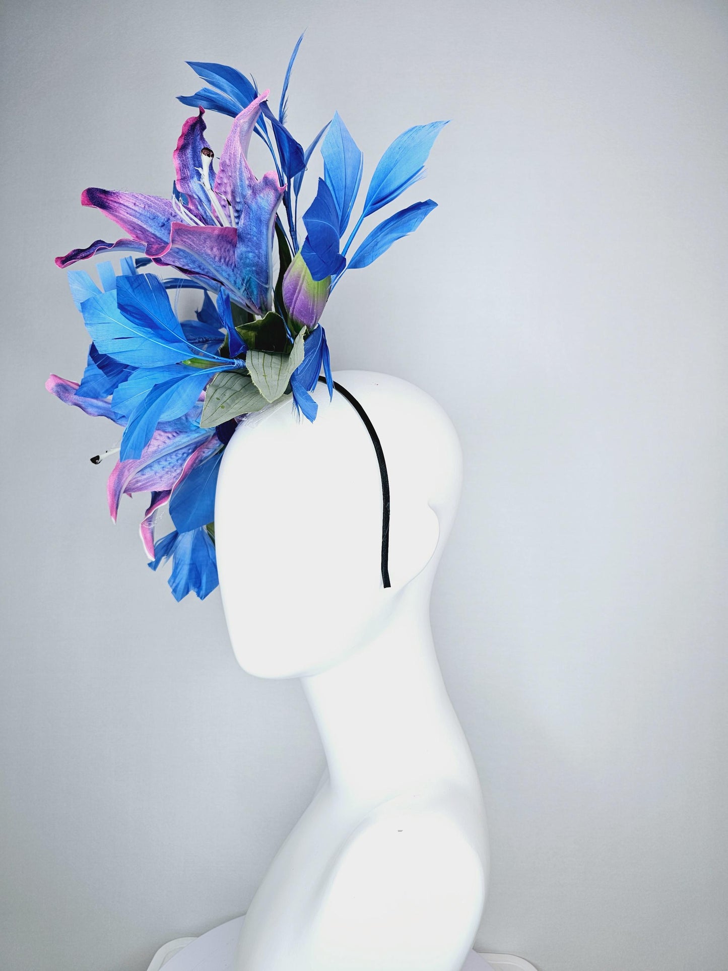 kentucky derby hat fascinator cobalt blue and pink ombre satin silk flowers with pastel green leaves and cobalt blue branching feathers