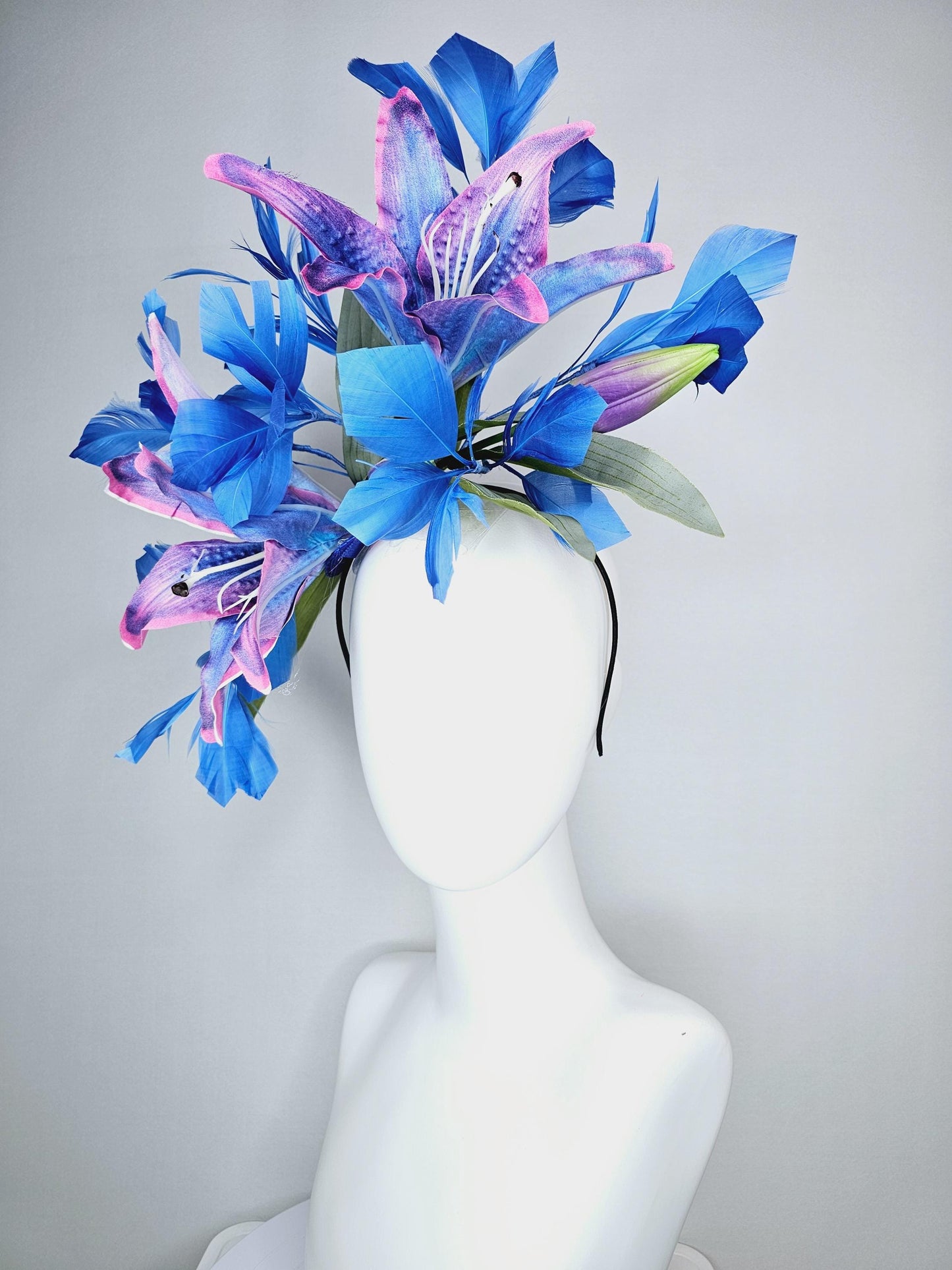 kentucky derby hat fascinator cobalt blue and pink ombre satin silk flowers with pastel green leaves and cobalt blue branching feathers