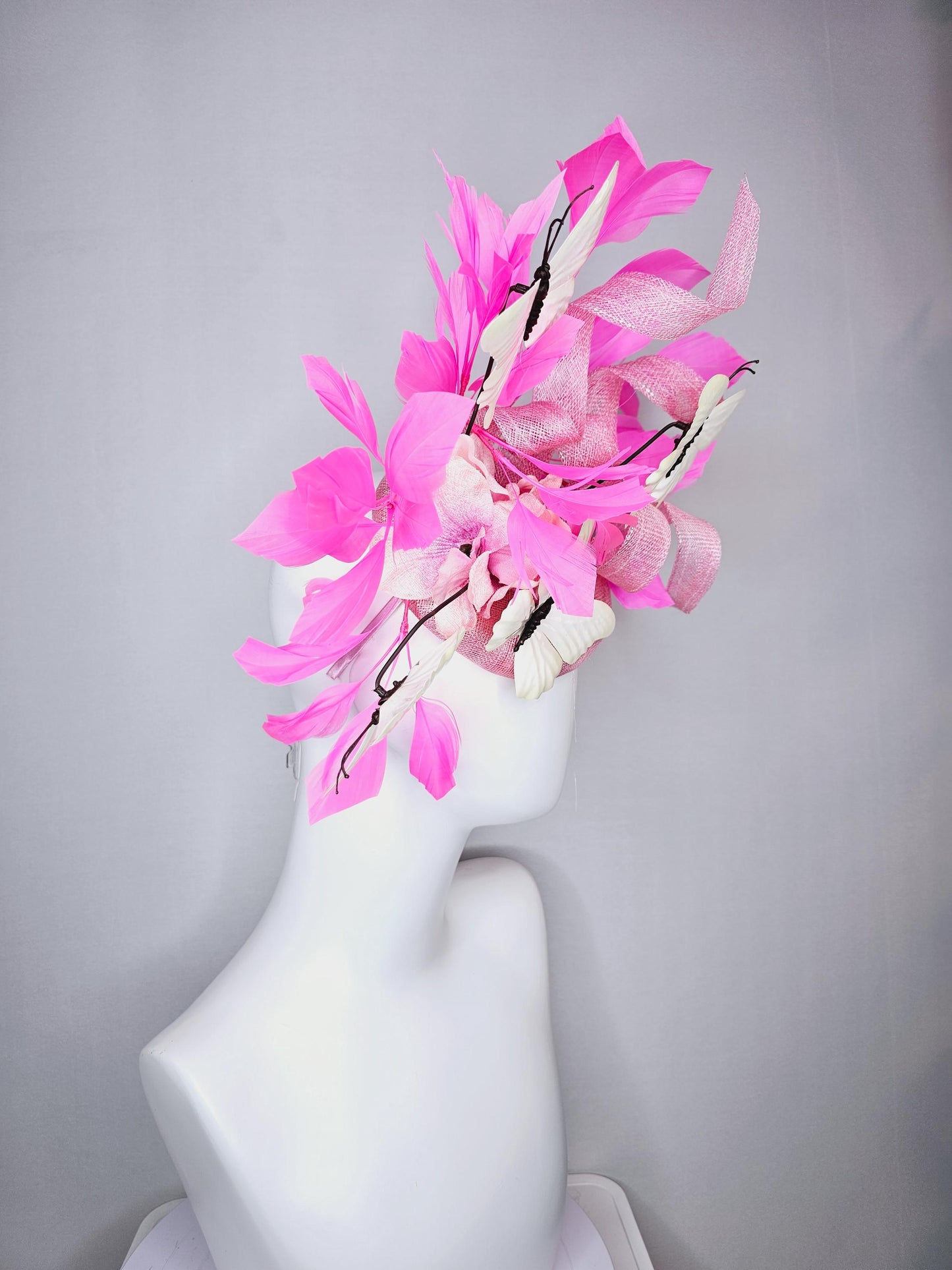 kentucky derby hat fascinator baby pink sinamay with tall curls baby pink satin flower white large butterflies and pink branching feathers