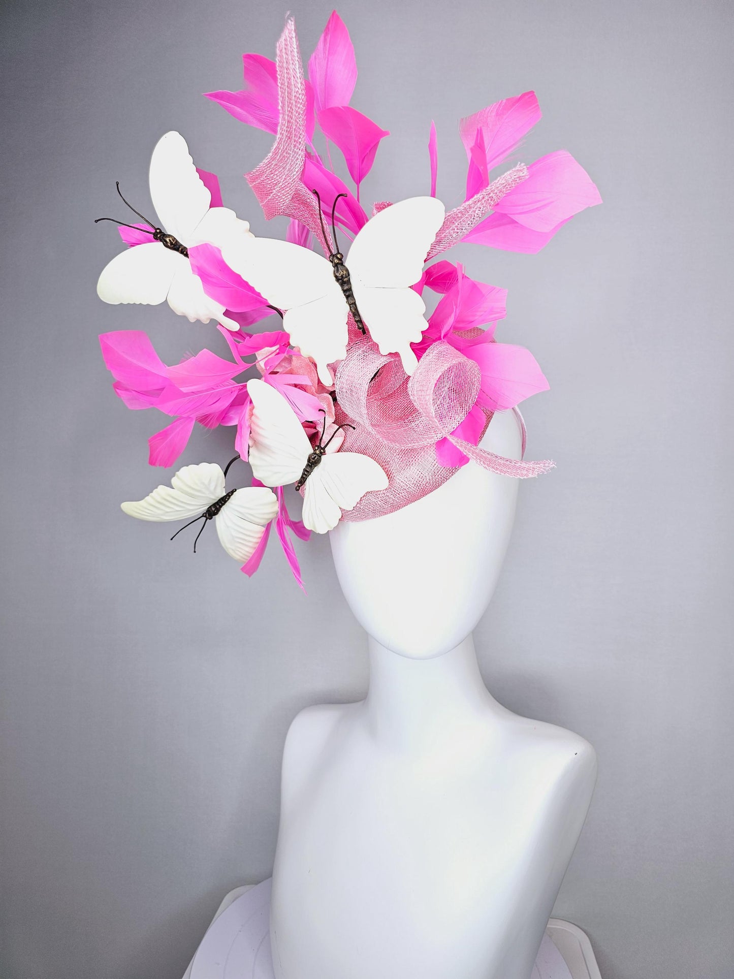 kentucky derby hat fascinator baby pink sinamay with tall curls baby pink satin flower white large butterflies and pink branching feathers