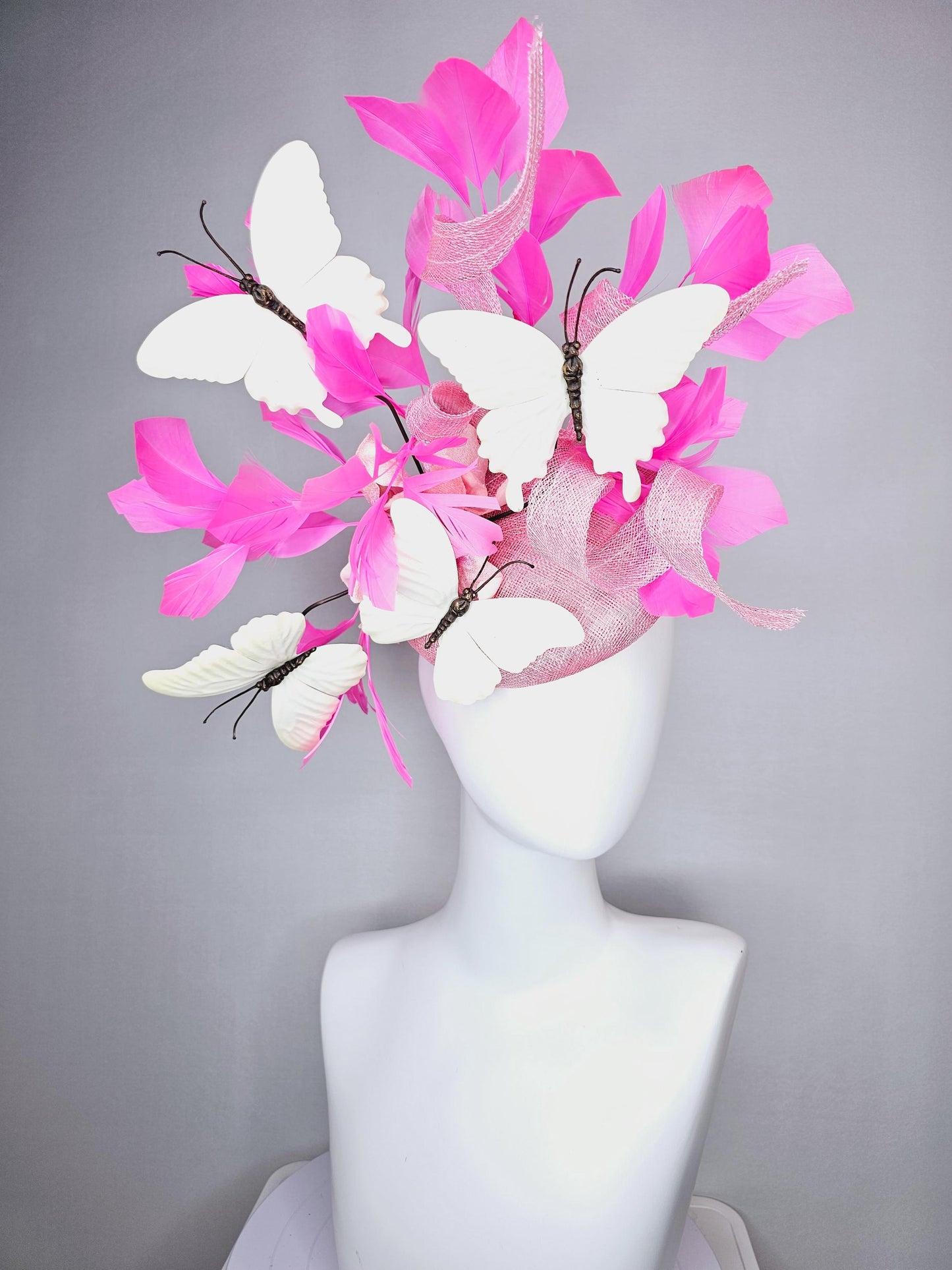 kentucky derby hat fascinator baby pink sinamay with tall curls baby pink satin flower white large butterflies and pink branching feathers