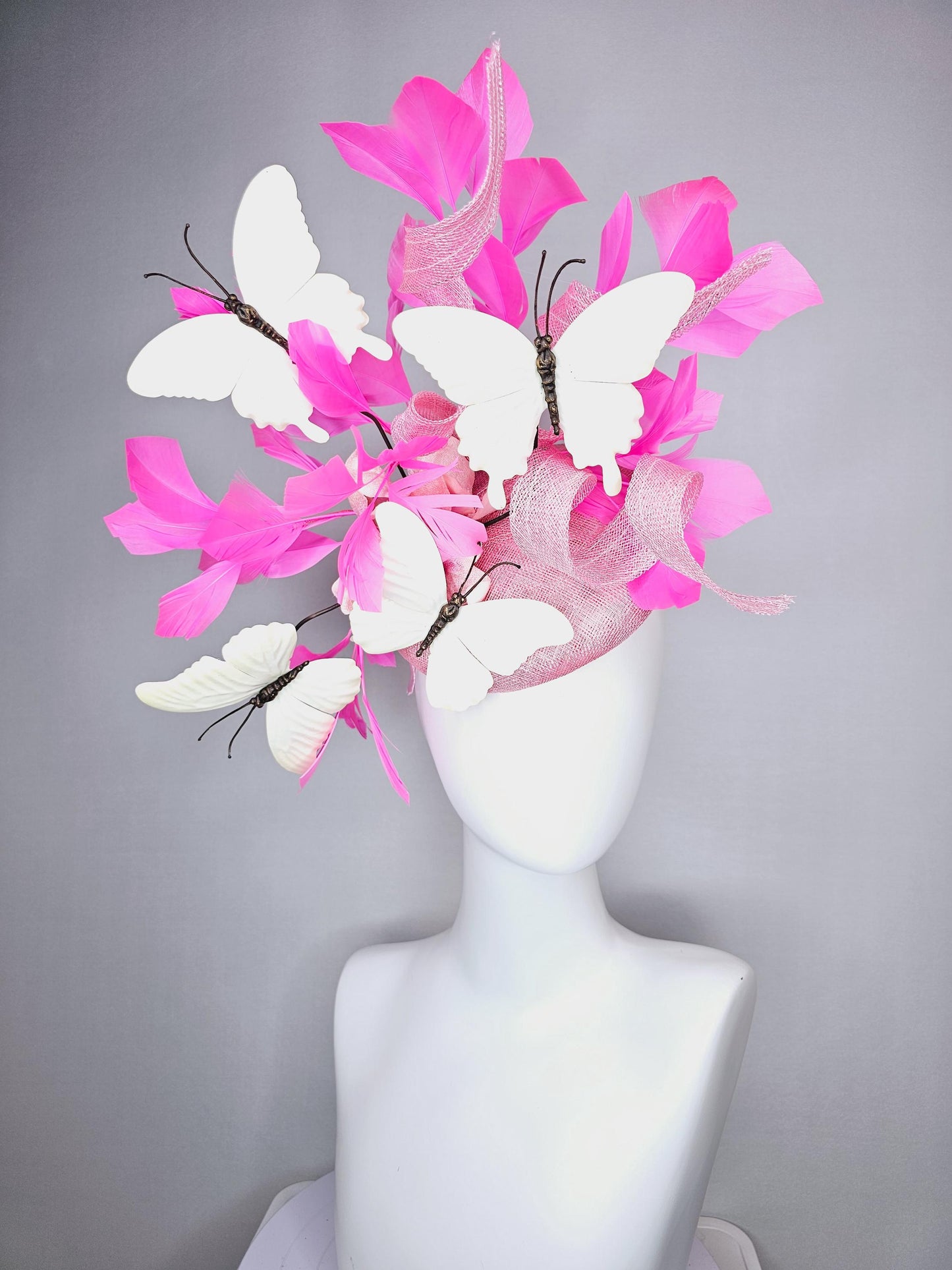 kentucky derby hat fascinator baby pink sinamay with tall curls baby pink satin flower white large butterflies and pink branching feathers