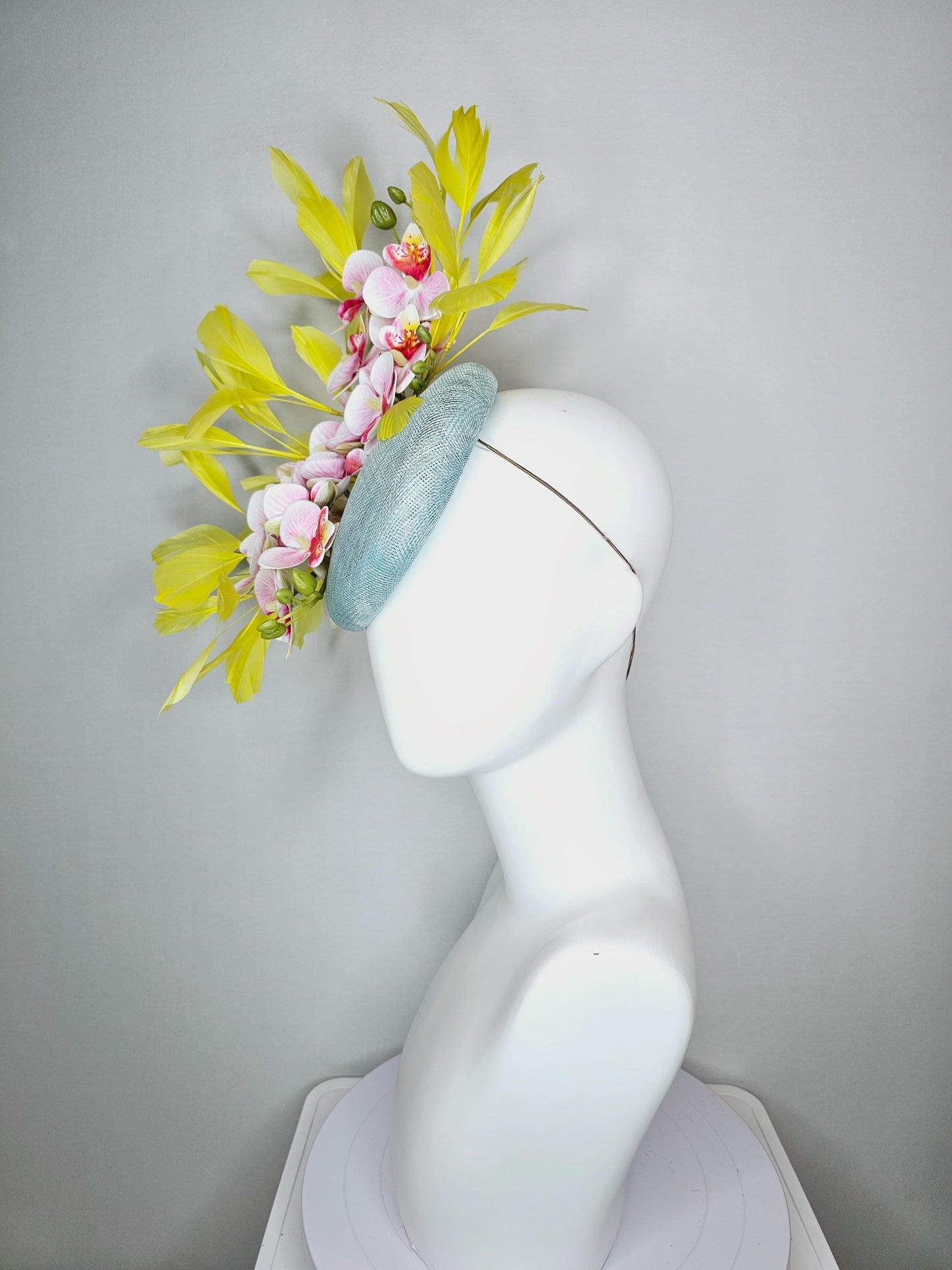 kentucky derby hat fascinator light blue sinamay with white blush pink satin orchid flowers with yellow branching feathers