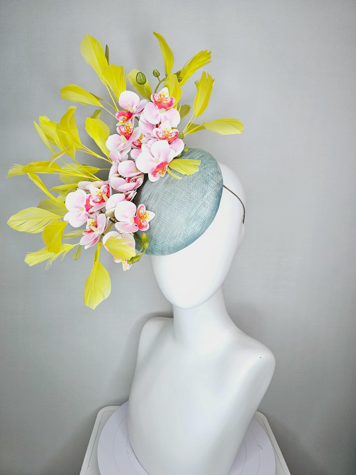 kentucky derby hat fascinator light blue sinamay with white blush pink satin orchid flowers with yellow branching feathers