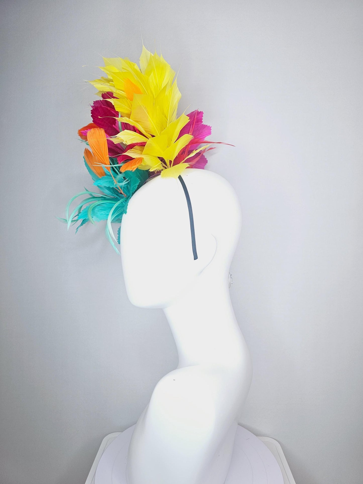 kentucky derby hat fascinator colorful fluffy aqua blue zigzag feather flower and hot pink fuchsia cherry red yellow branching feathers