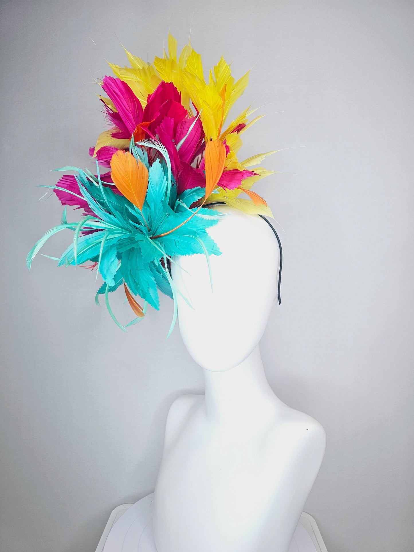 kentucky derby hat fascinator colorful fluffy aqua blue zigzag feather flower and hot pink fuchsia cherry red yellow branching feathers