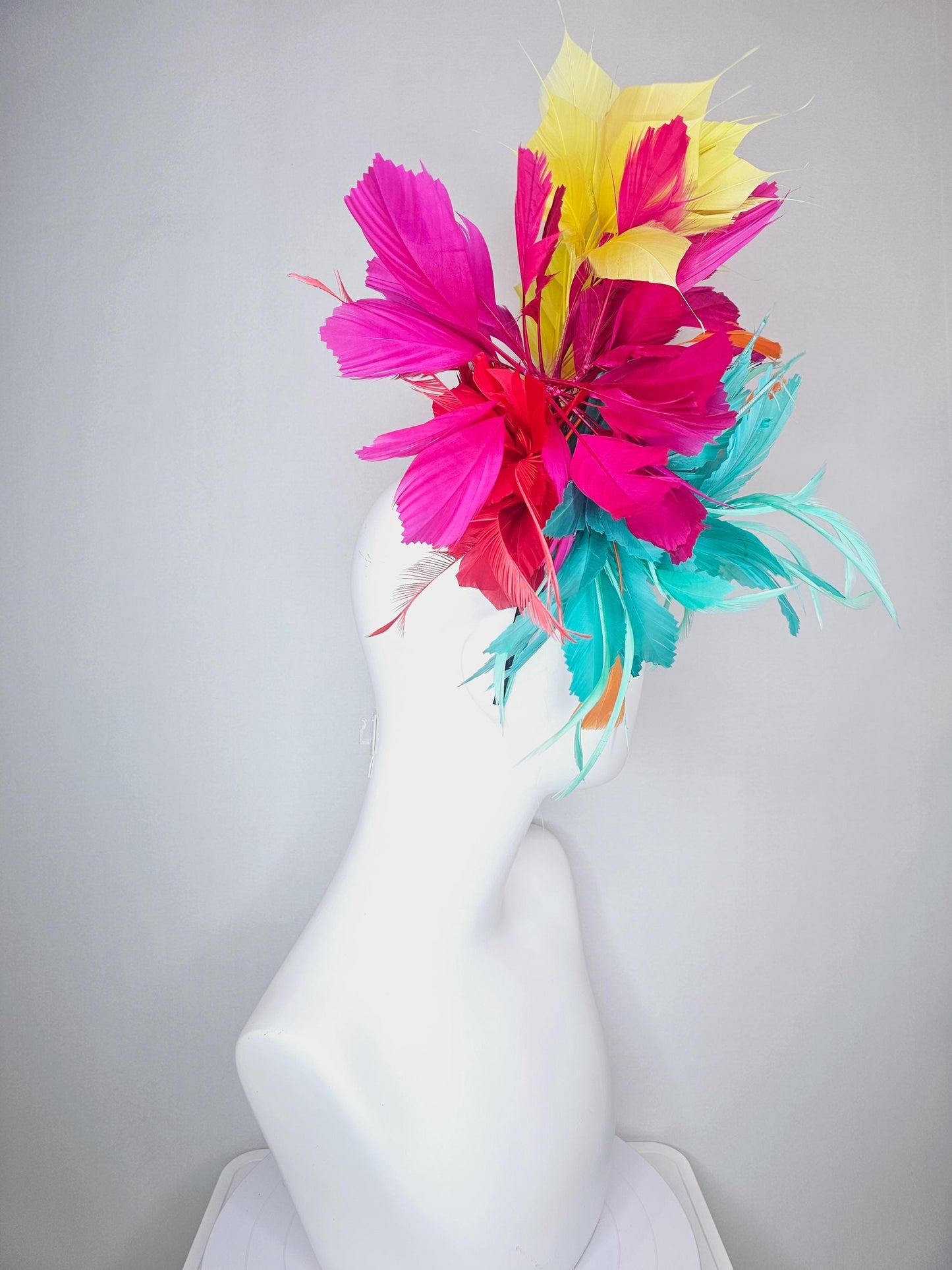 kentucky derby hat fascinator colorful fluffy aqua blue zigzag feather flower and hot pink fuchsia cherry red yellow branching feathers