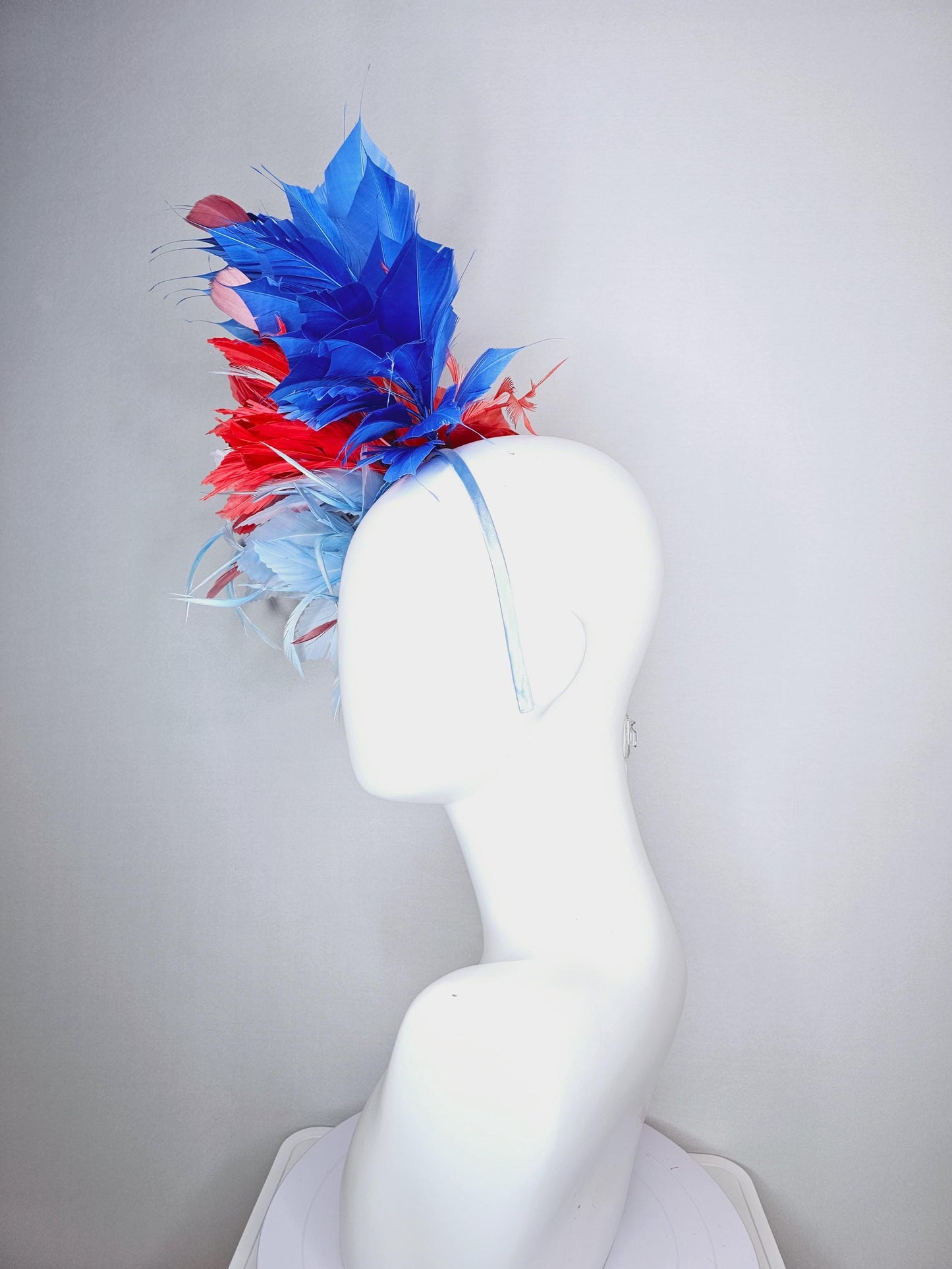 kentucky derby hat fascinator fluffy light blue zigzag feather flower and coral red royal cobalt blue baby blue branching feathers