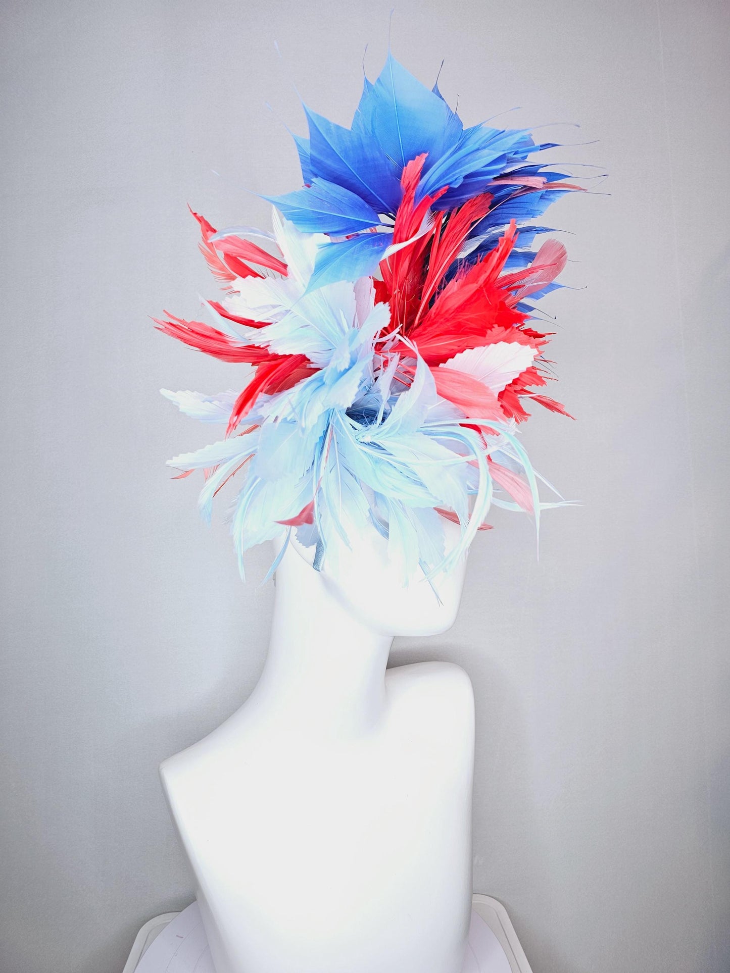 kentucky derby hat fascinator fluffy light blue zigzag feather flower and coral red royal cobalt blue baby blue branching feathers