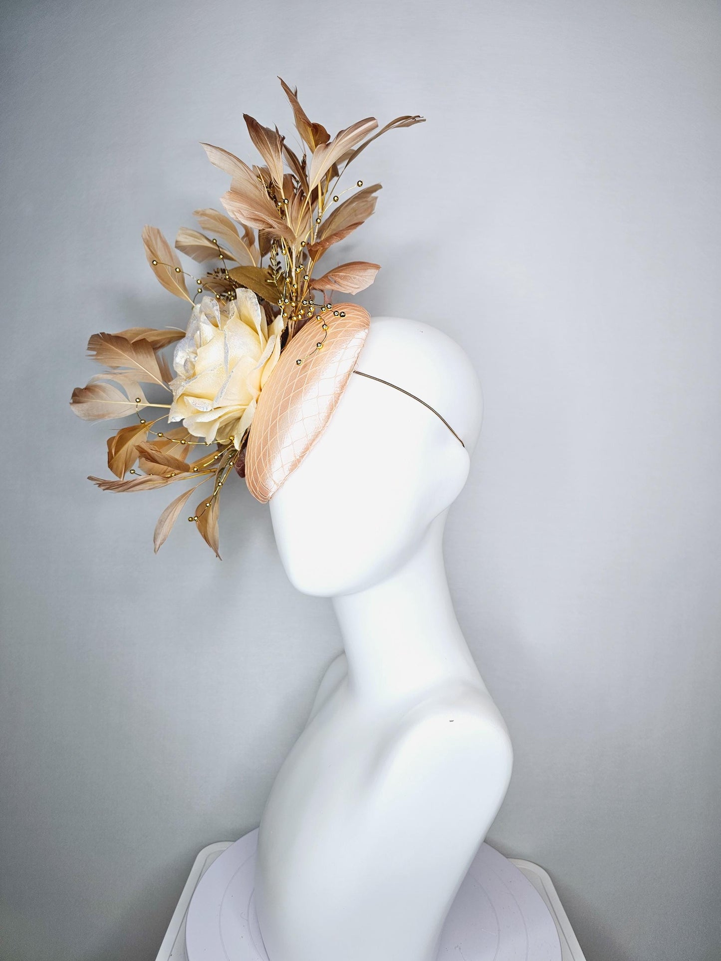 kentucky derby hat fascinator champagne pink satin with netting neutral cream satin rose flower gold leaves tan beige branching feathers